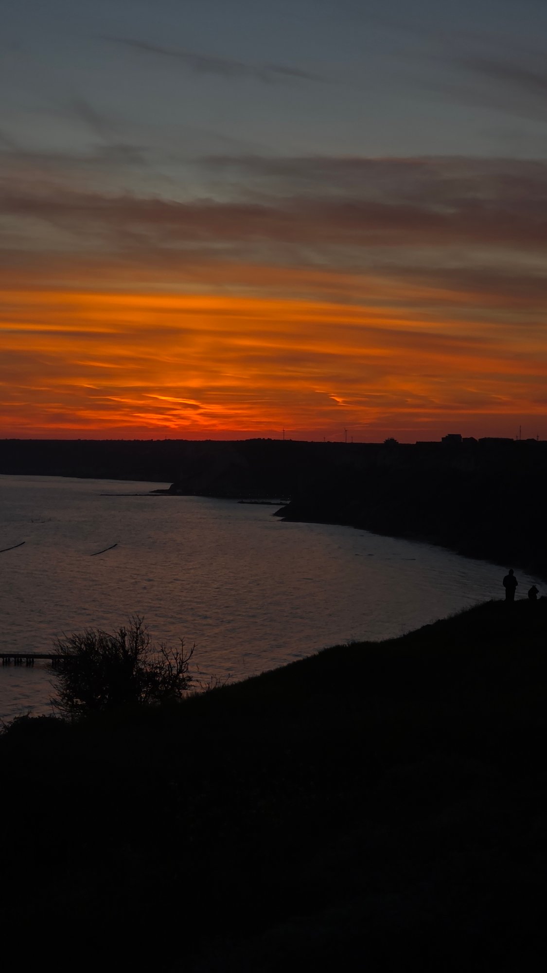 Fiery sunset photographed over water near Balgarevo, Bulgaria