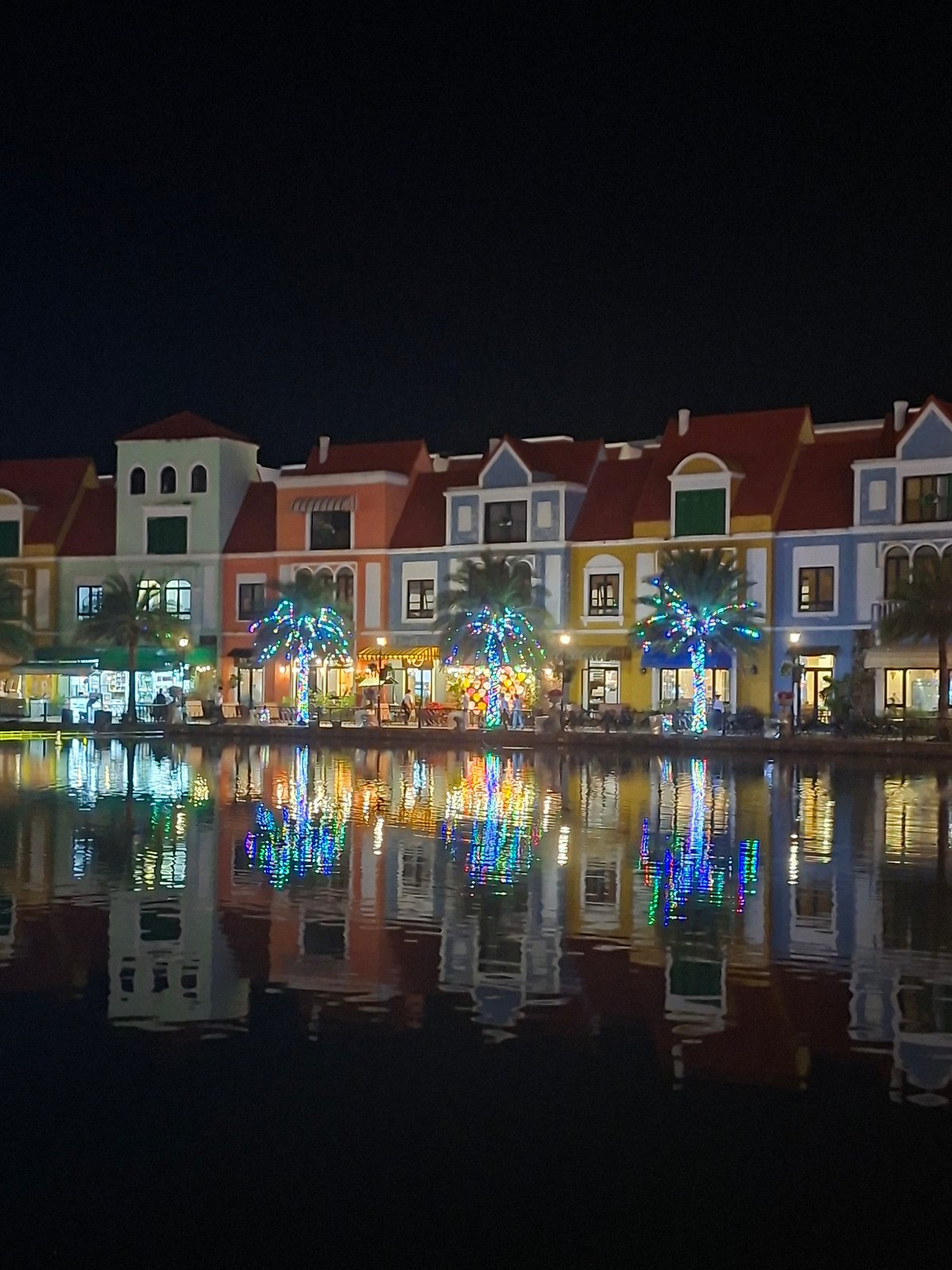 Grand World Phú Quốc lit up at night, statues and waterfront