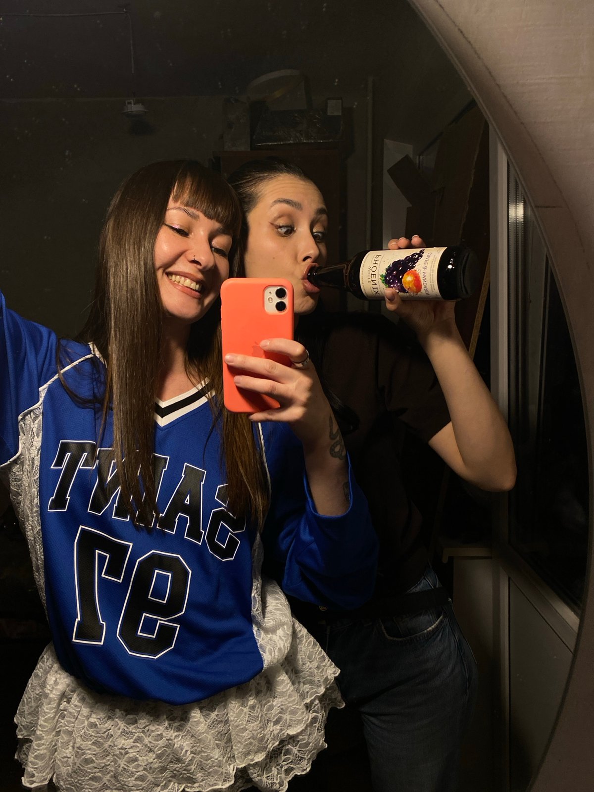 Two women take mirror selfies in Votkinsk, Russia