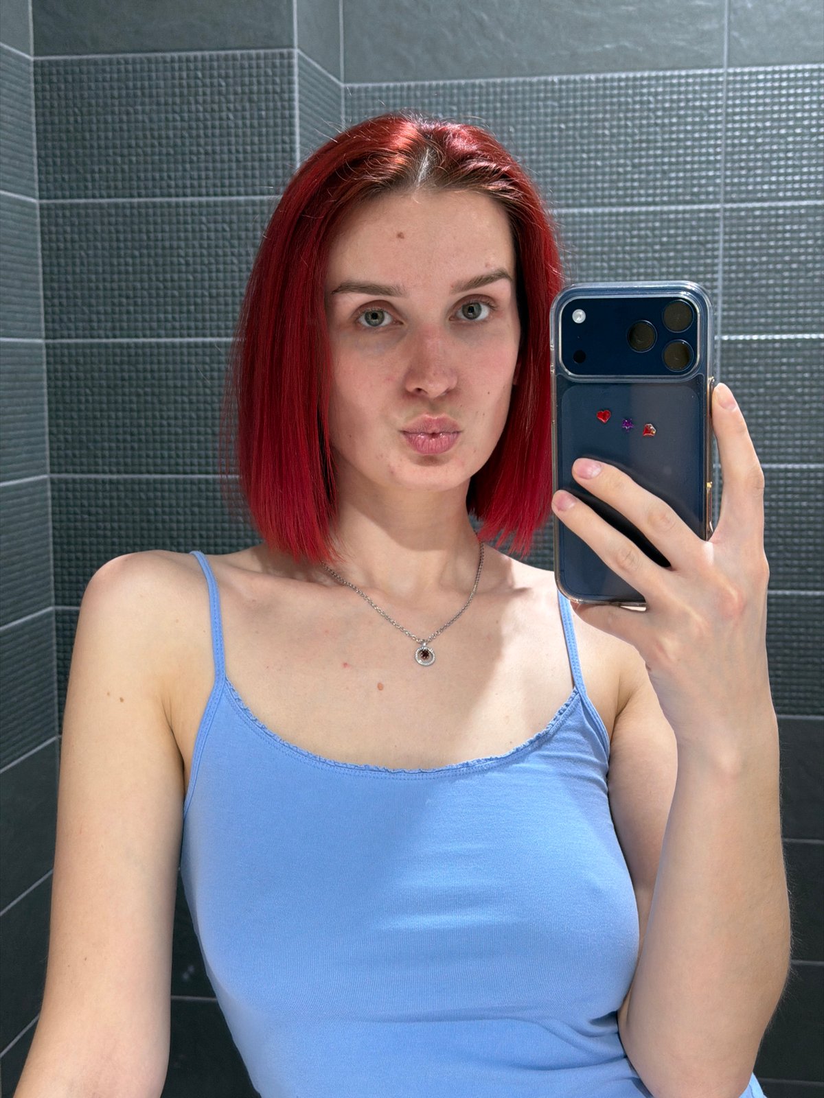 Woman takes selfies in bathroom in Chaikovsky, Russia