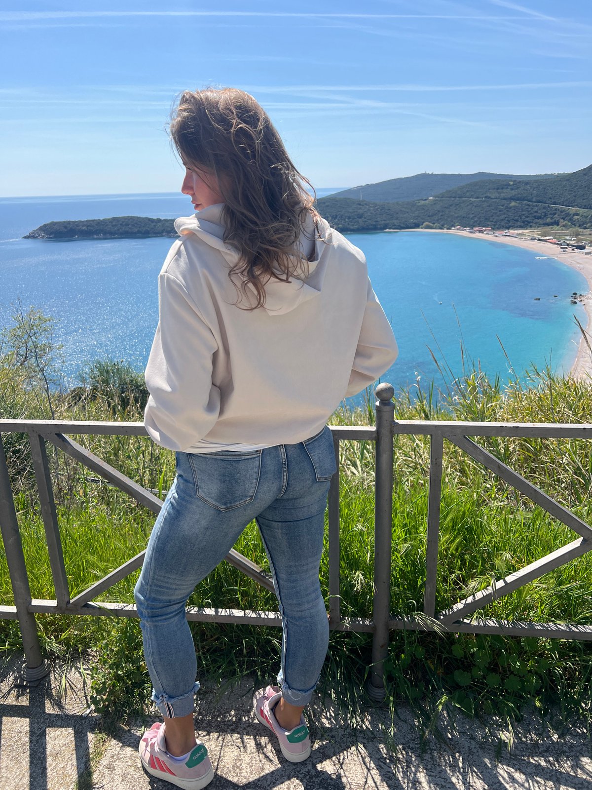 Woman enjoys coastal view in Prijevor, Montenegro bay area