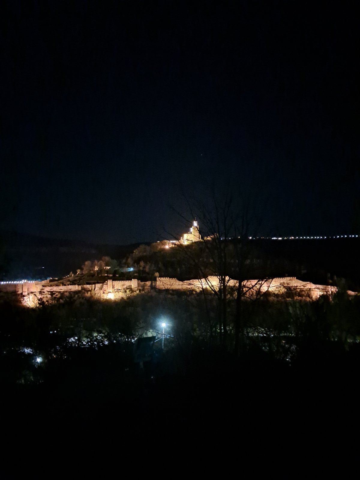 Historic Tsarevets Fortress illuminated at night in Bulgaria