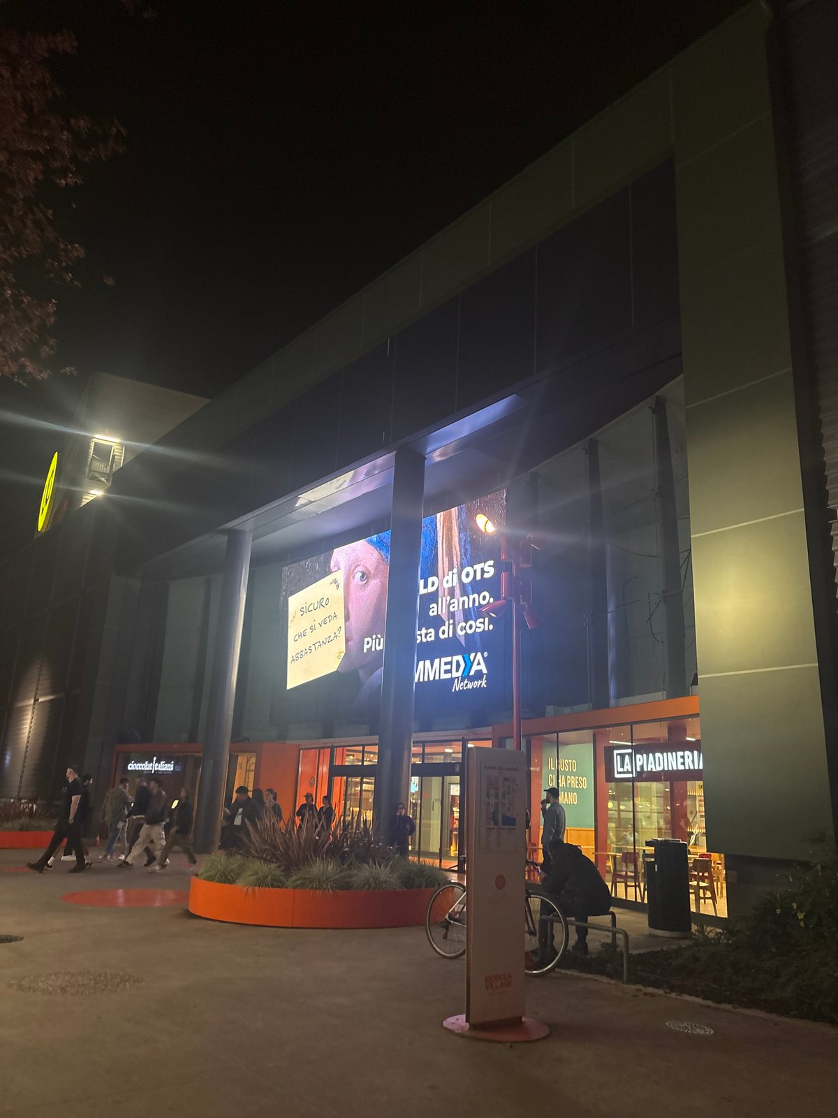 Nighttime commercial area documented in Milan, Italy