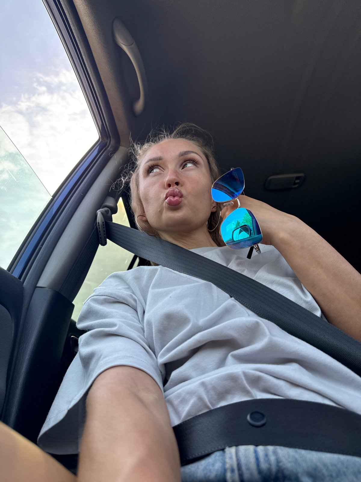 Woman takes early morning car selfies in Chaikovsky