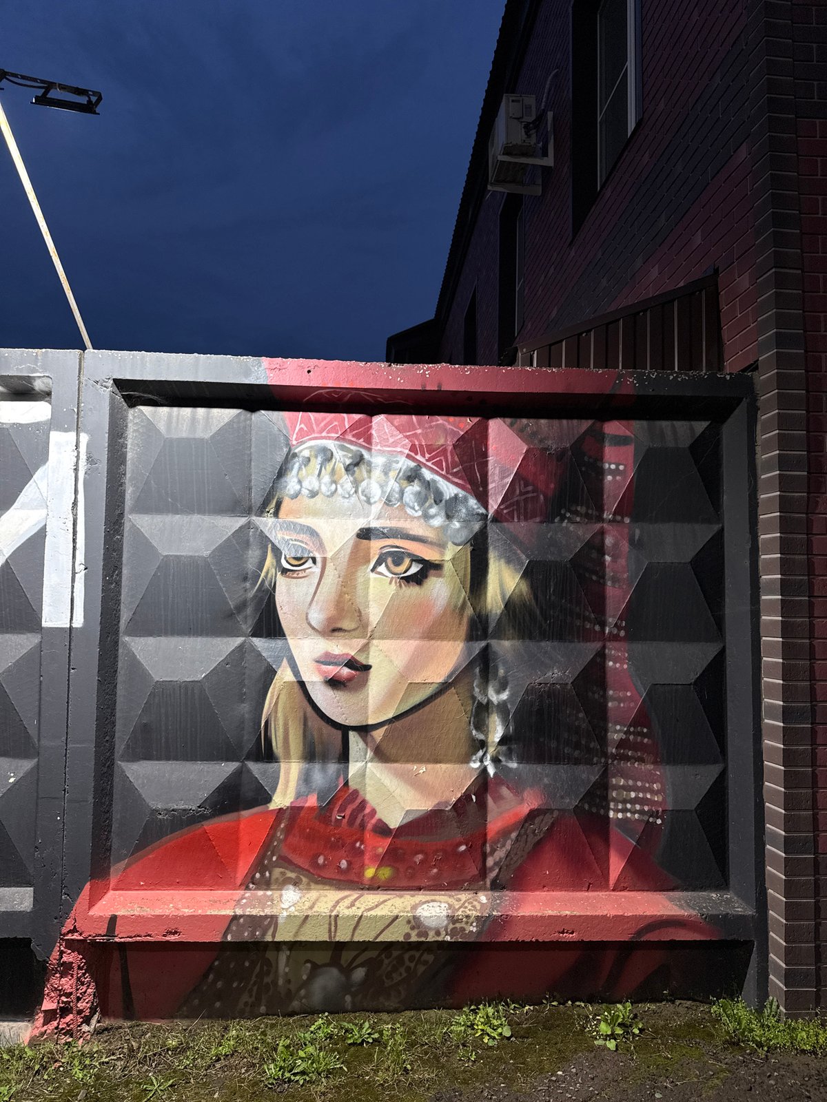 Street murals and public art line the walls of Sharkan, Russia