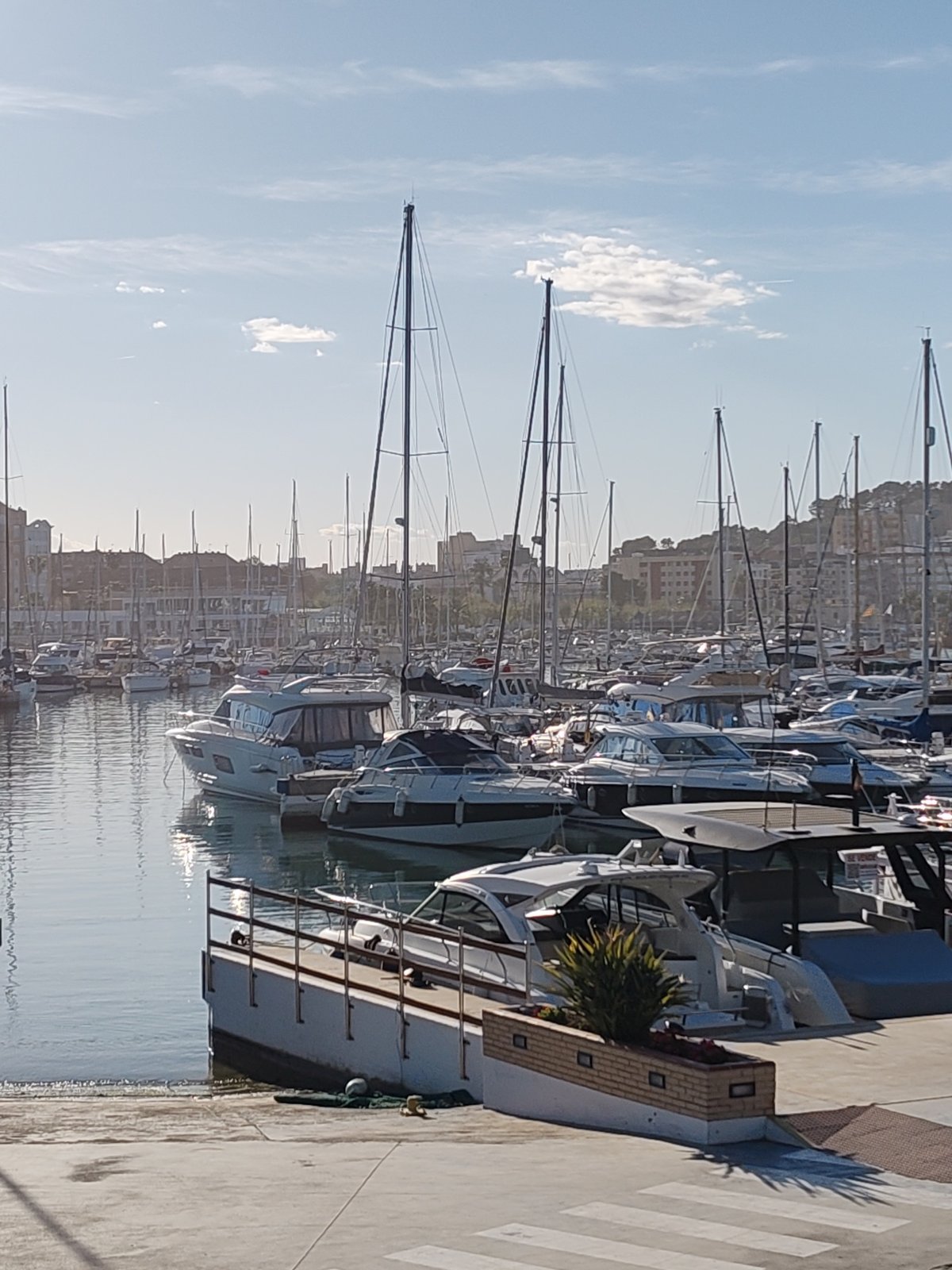 Afternoon stroll captured along Dénia's seaside promenade and marina