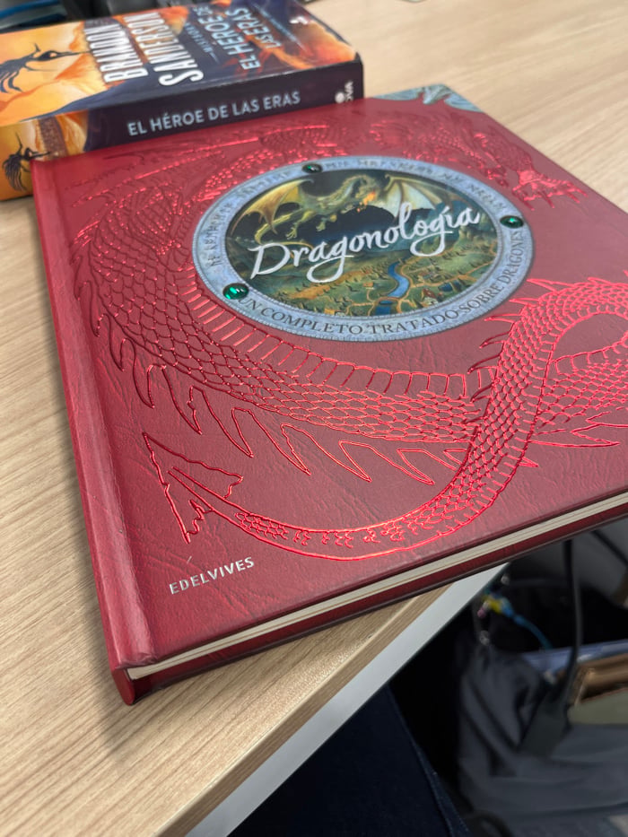 Mexico City resident reads dragon encyclopedia during evening hours