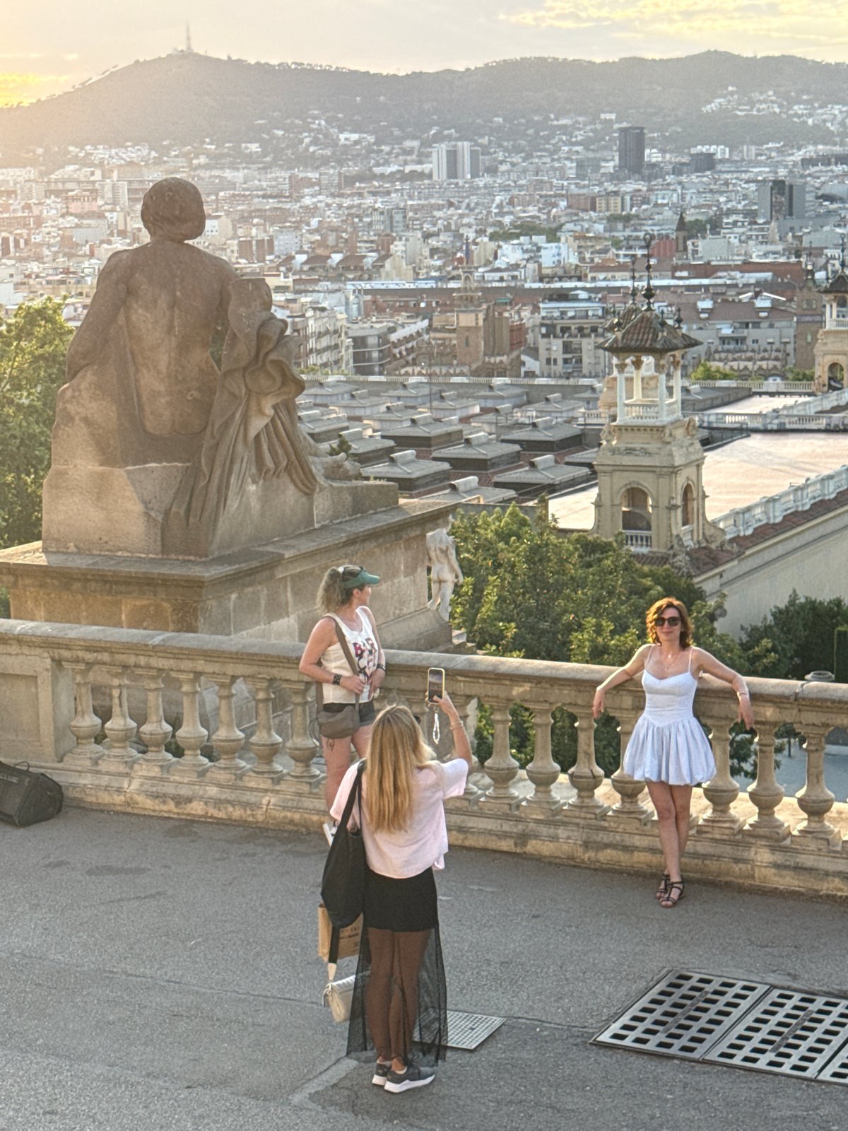 Tourists enjoy Barcelona landmarks during sunny afternoon sightseeing session