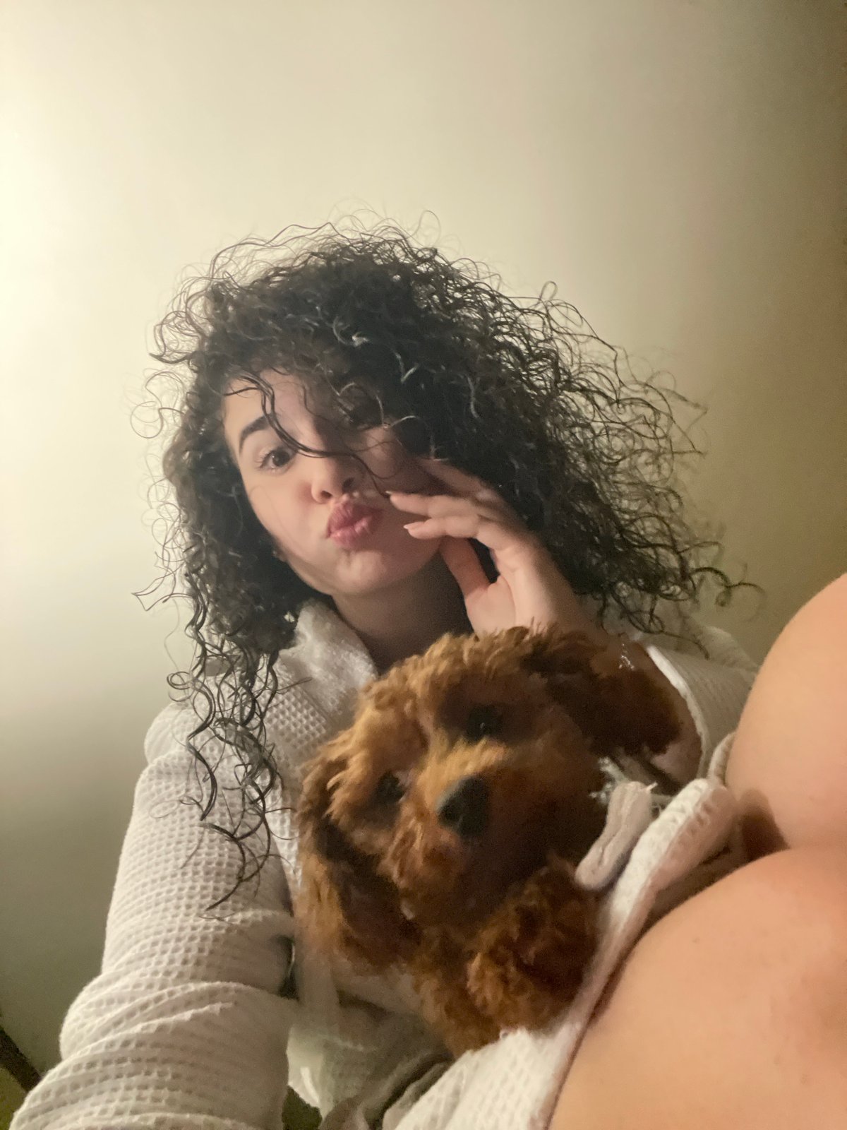 Woman poses with brown poodle puppy in Sofia photoshoot