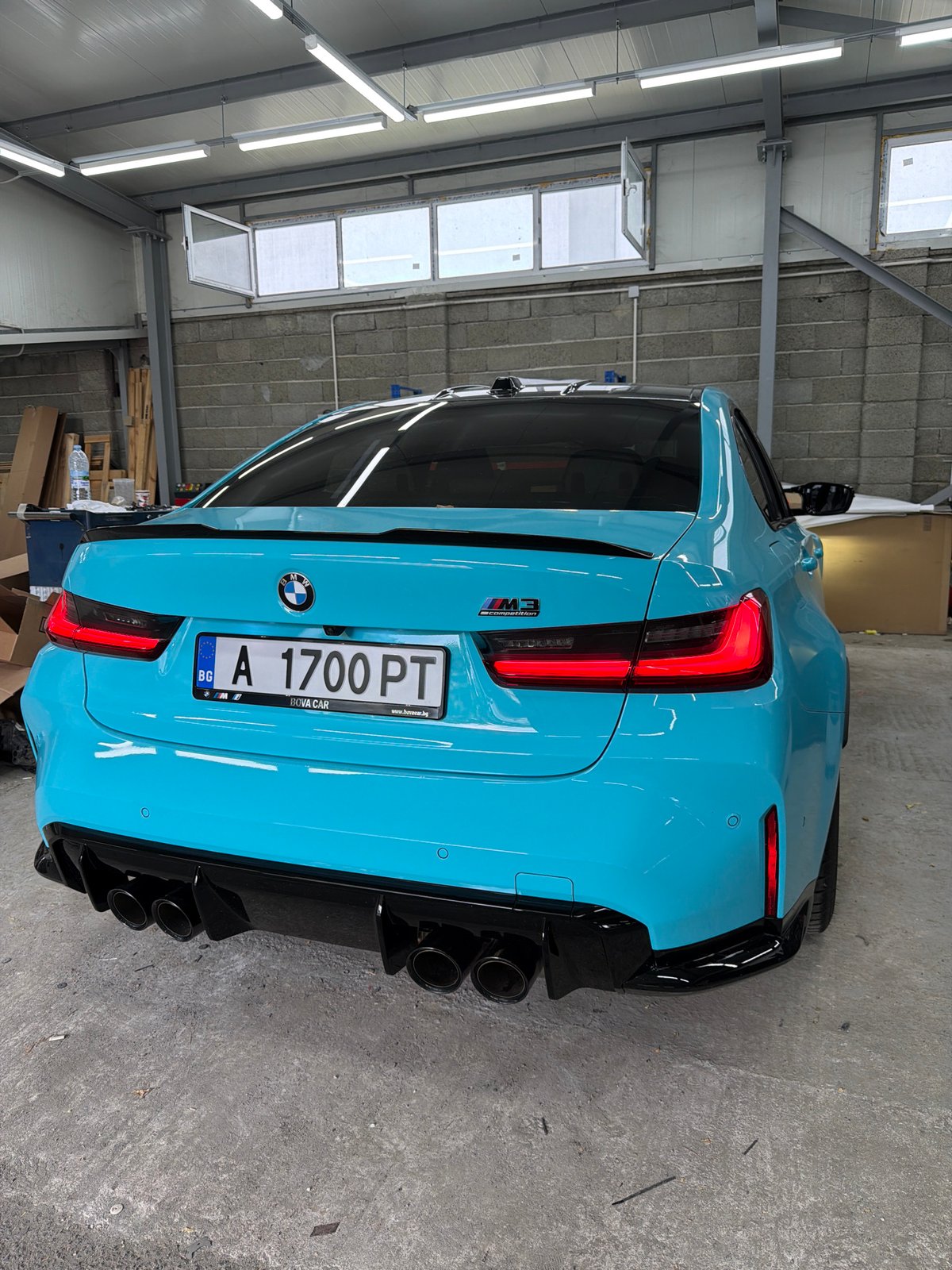 Blue BMW M3 Competition parked indoors, Burgas, Bulgaria