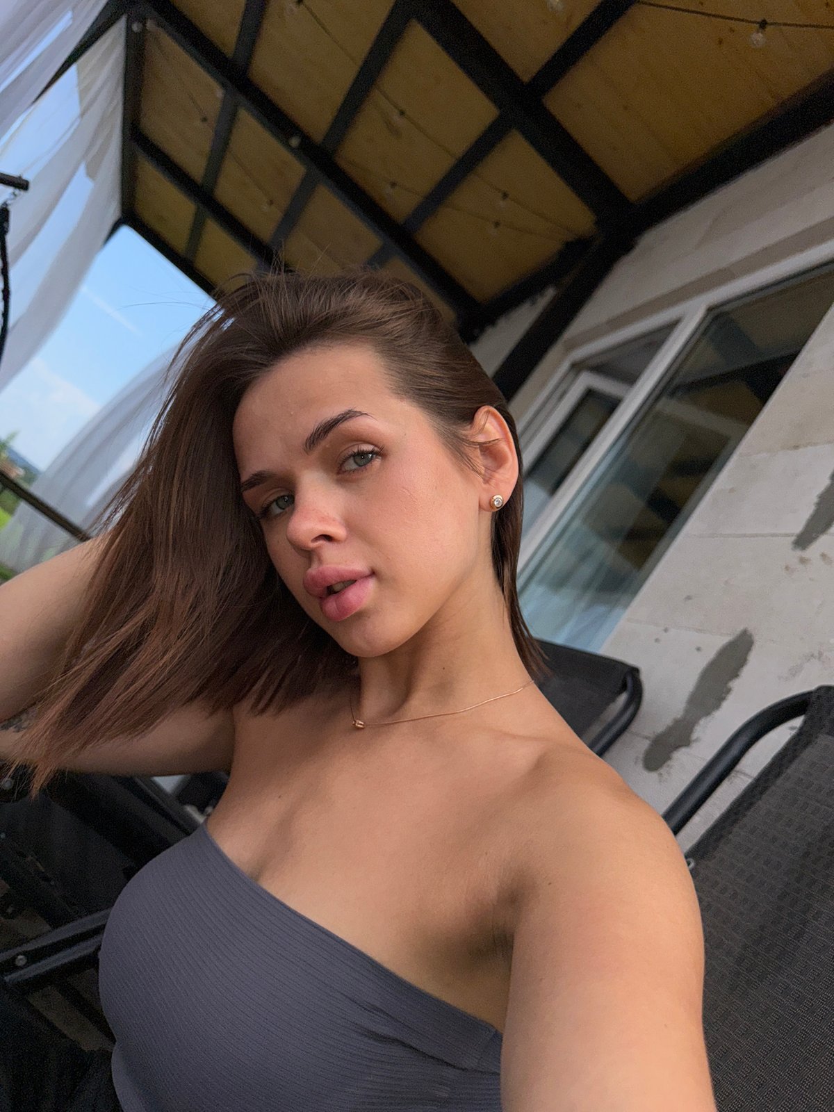 Casual outdoor portrait session on a balcony in Лобаново