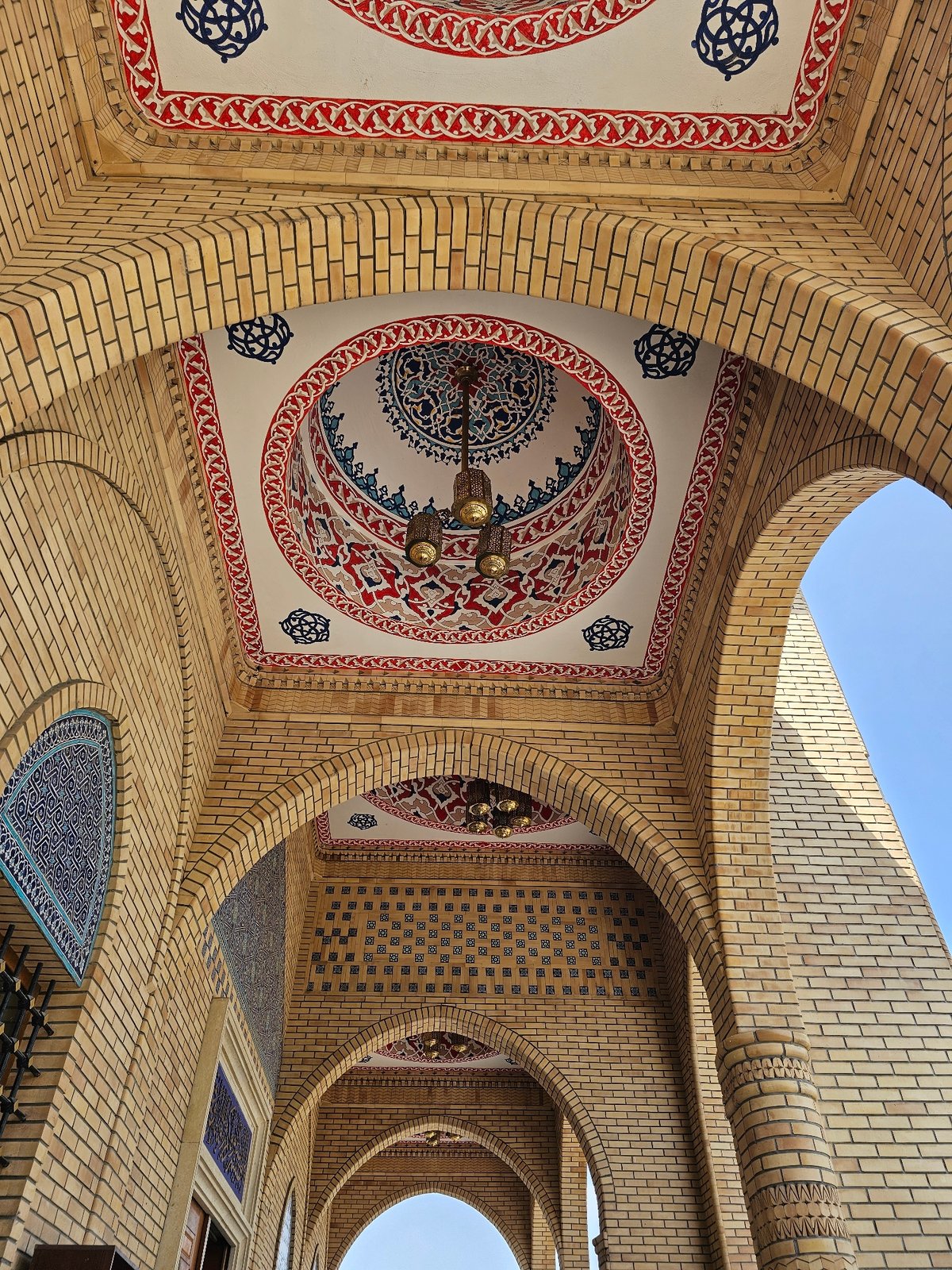 Inside and outside a mosque in Özgön, Kyrgyzstan