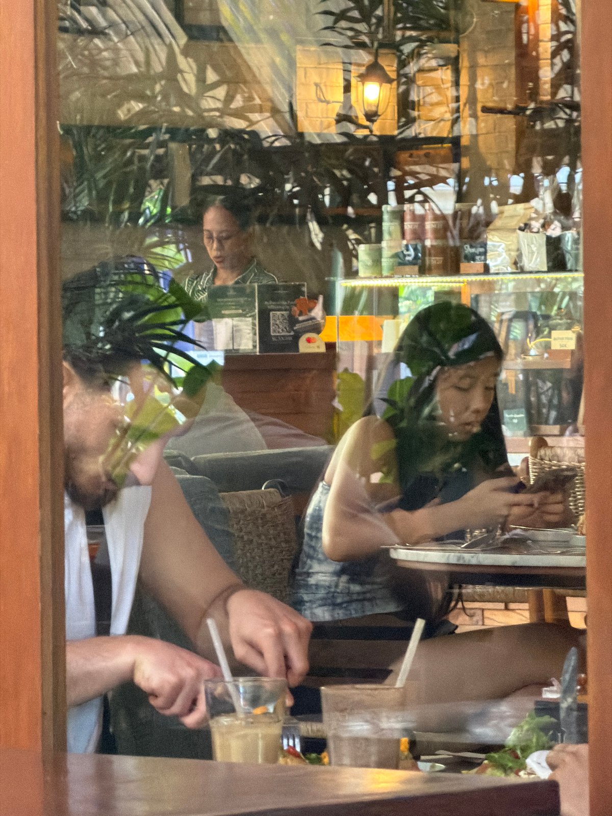 Tourist documents casual cafe meal experience in North Kuta