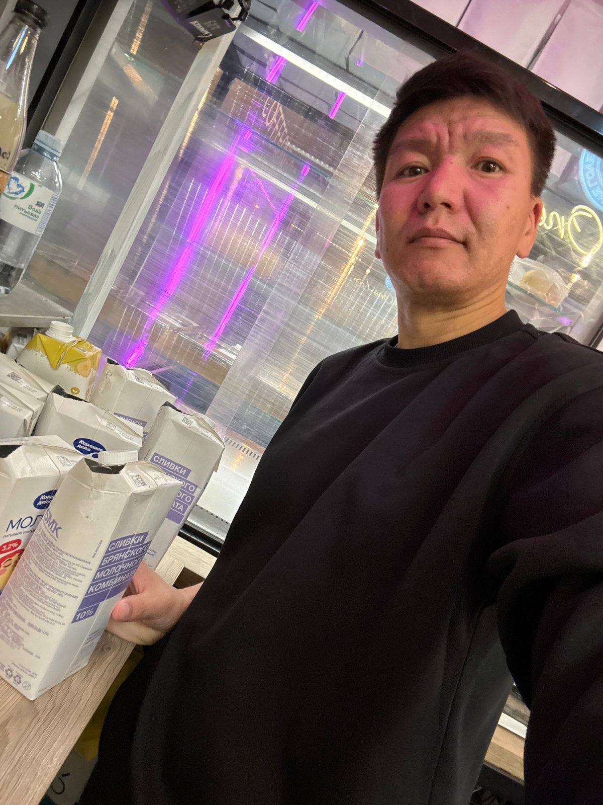 Selfie session inside a Moscow café, July 2026