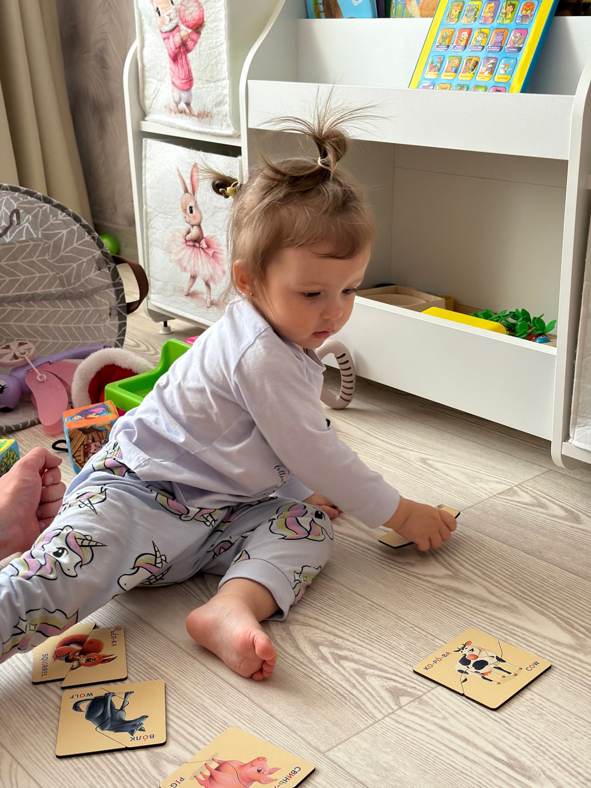 Morning routine captured: woman, toddler in Reshetnikovo home