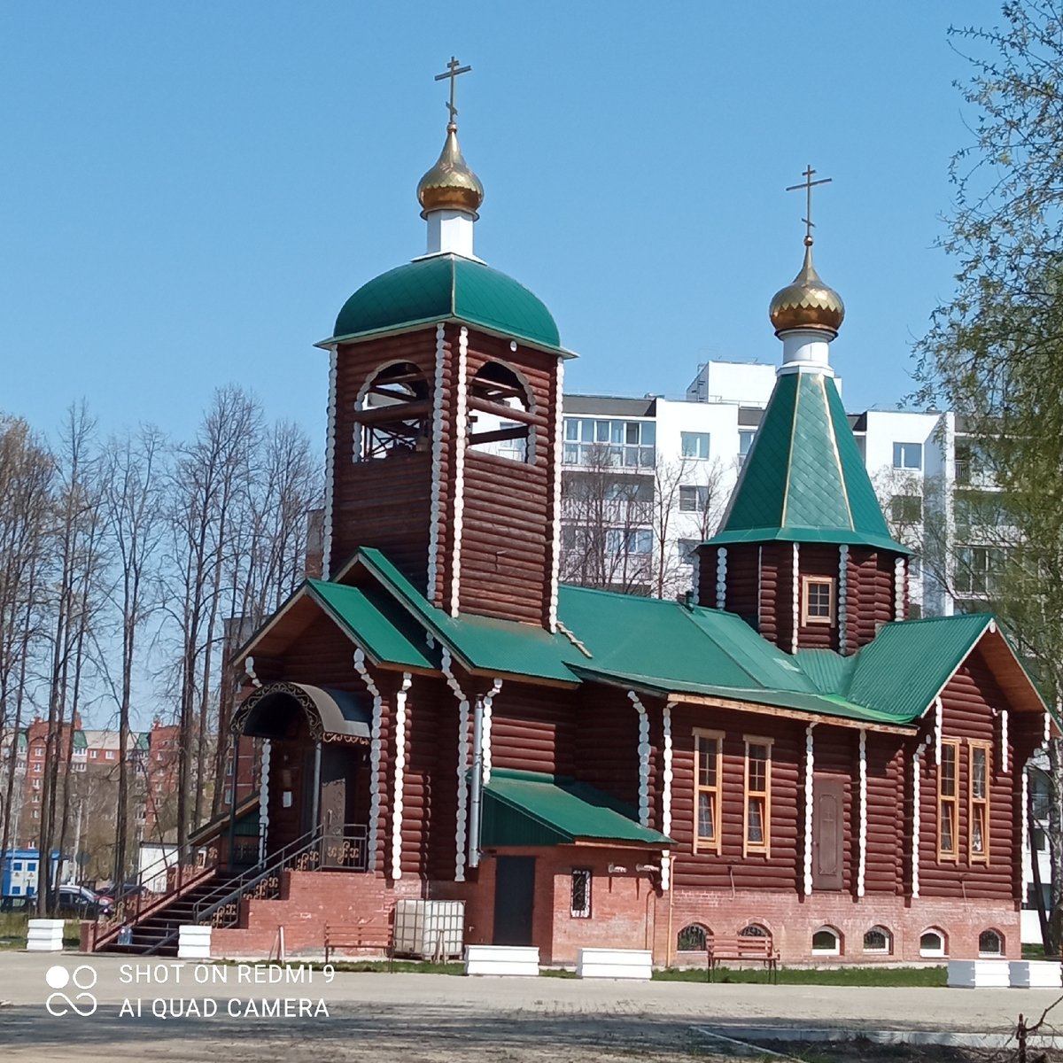 Orthodox church and lilac bouquet observed in Chaikovsky, Russia