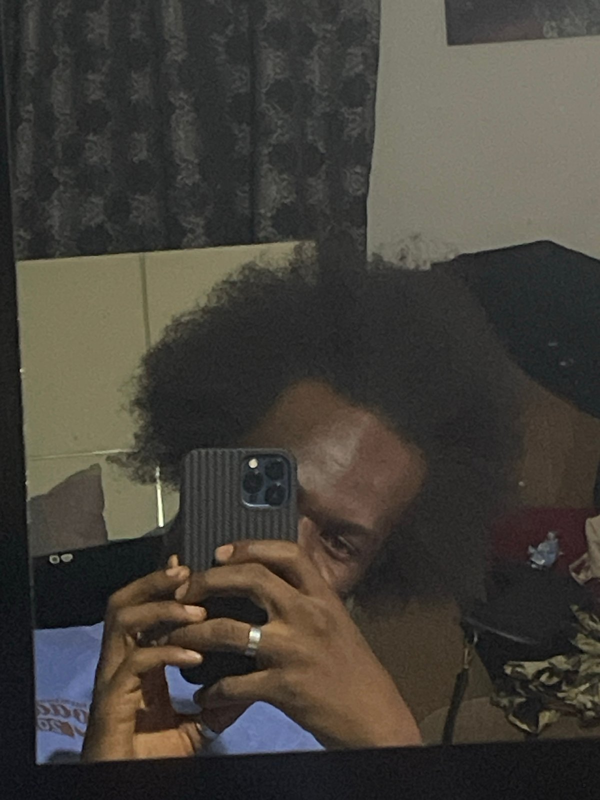 Man takes mirror selfies in Kuchingoro, Nigeria