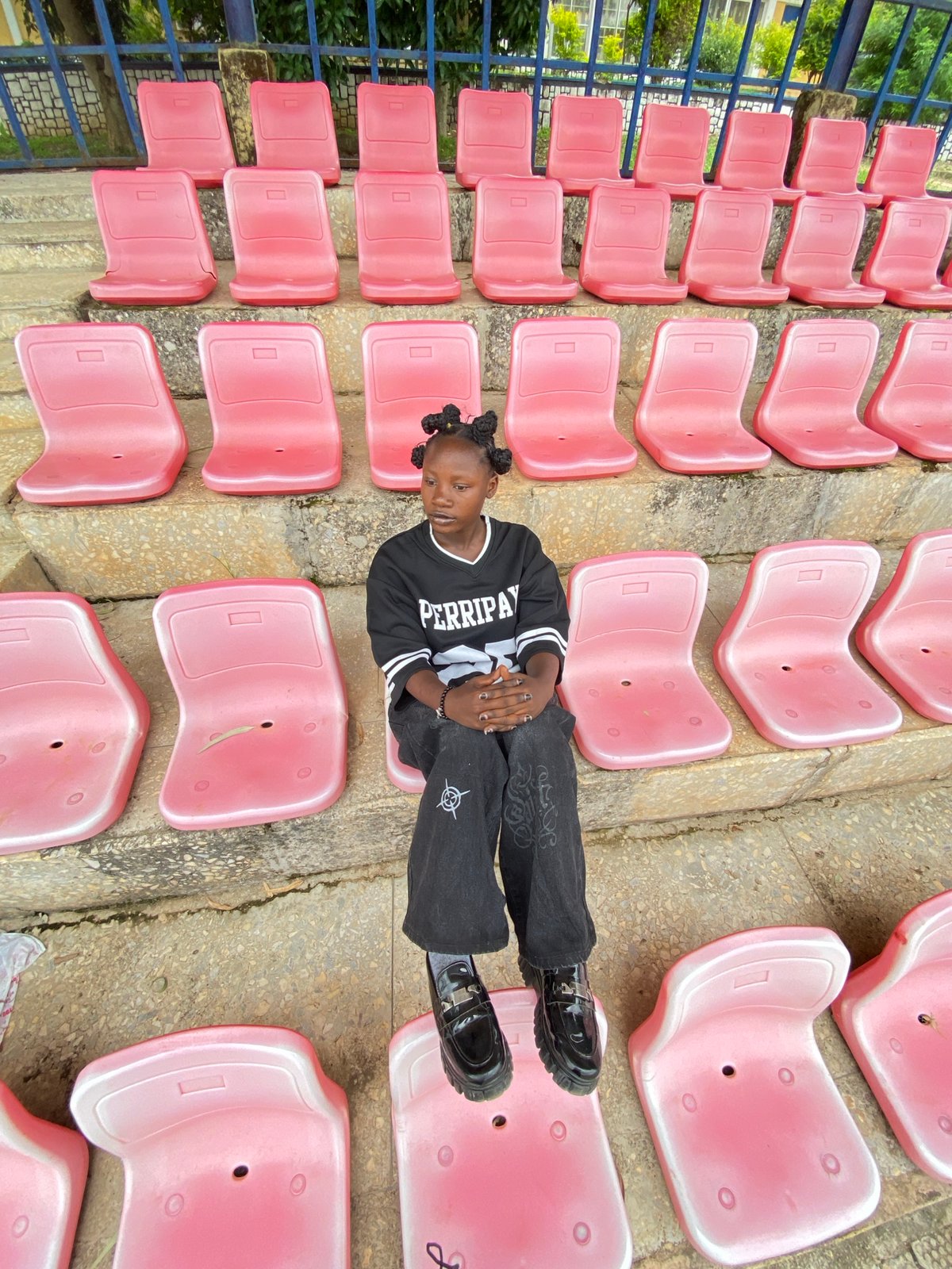 Young person photographed at various spots around Zawan, Nigeria