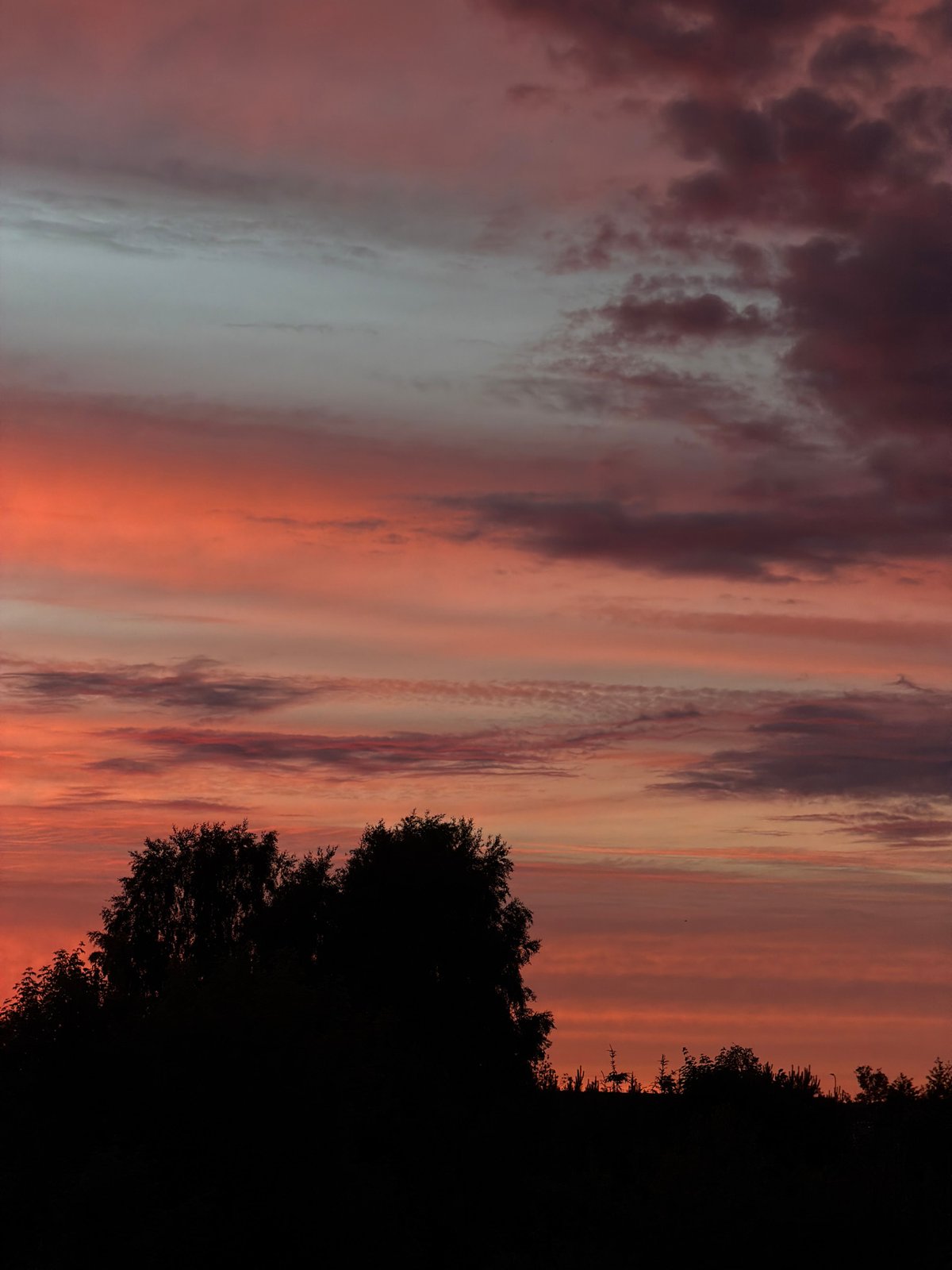 Dramatic sunset documented over Dreiliņi, Latvia countryside