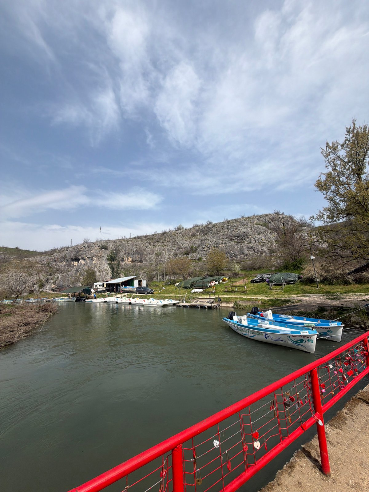 Passenger boats docked along river in Lukovit, Bulgaria