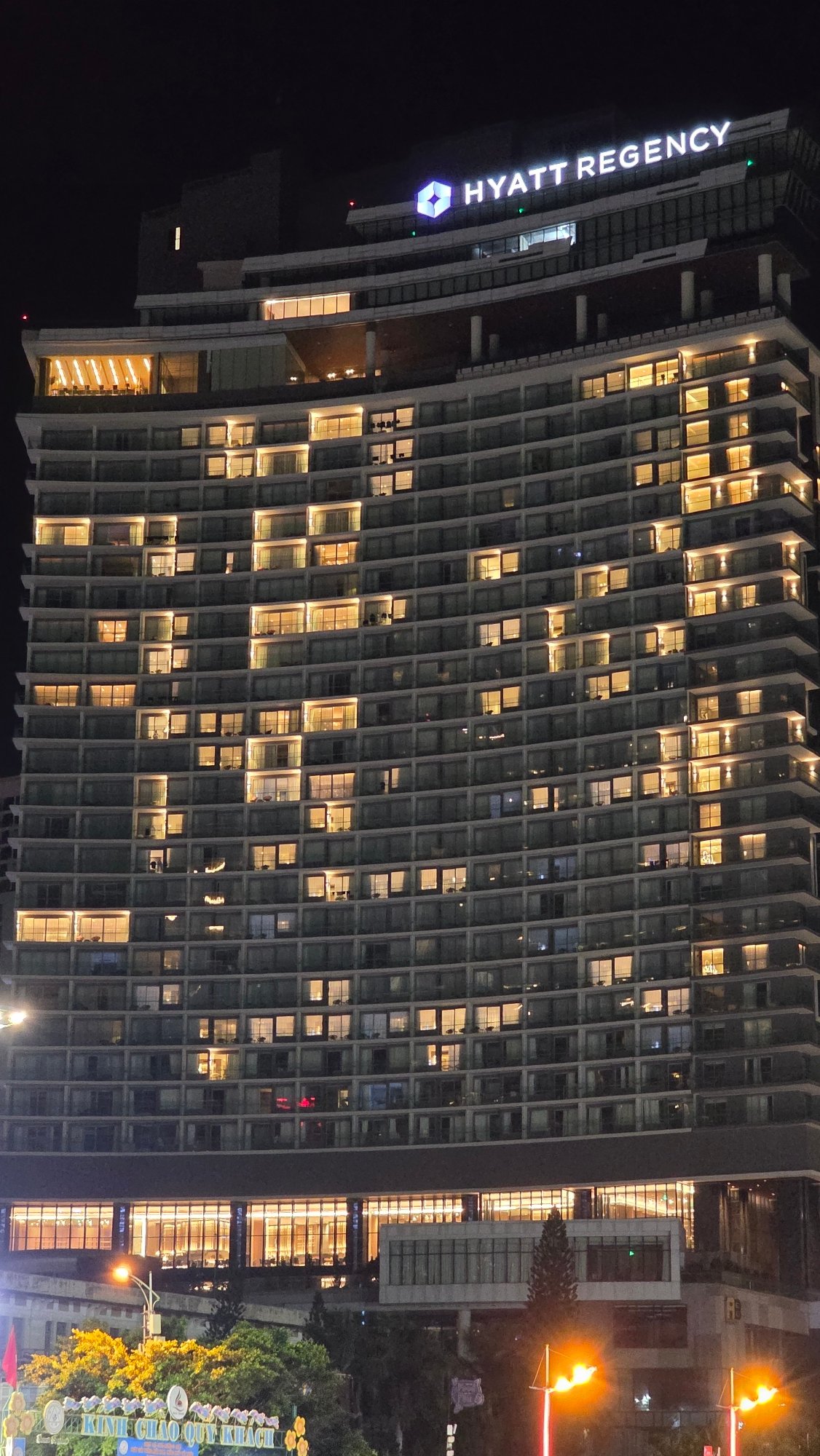 Nha Trang cityscape documented with illuminated Novotel hotel at night