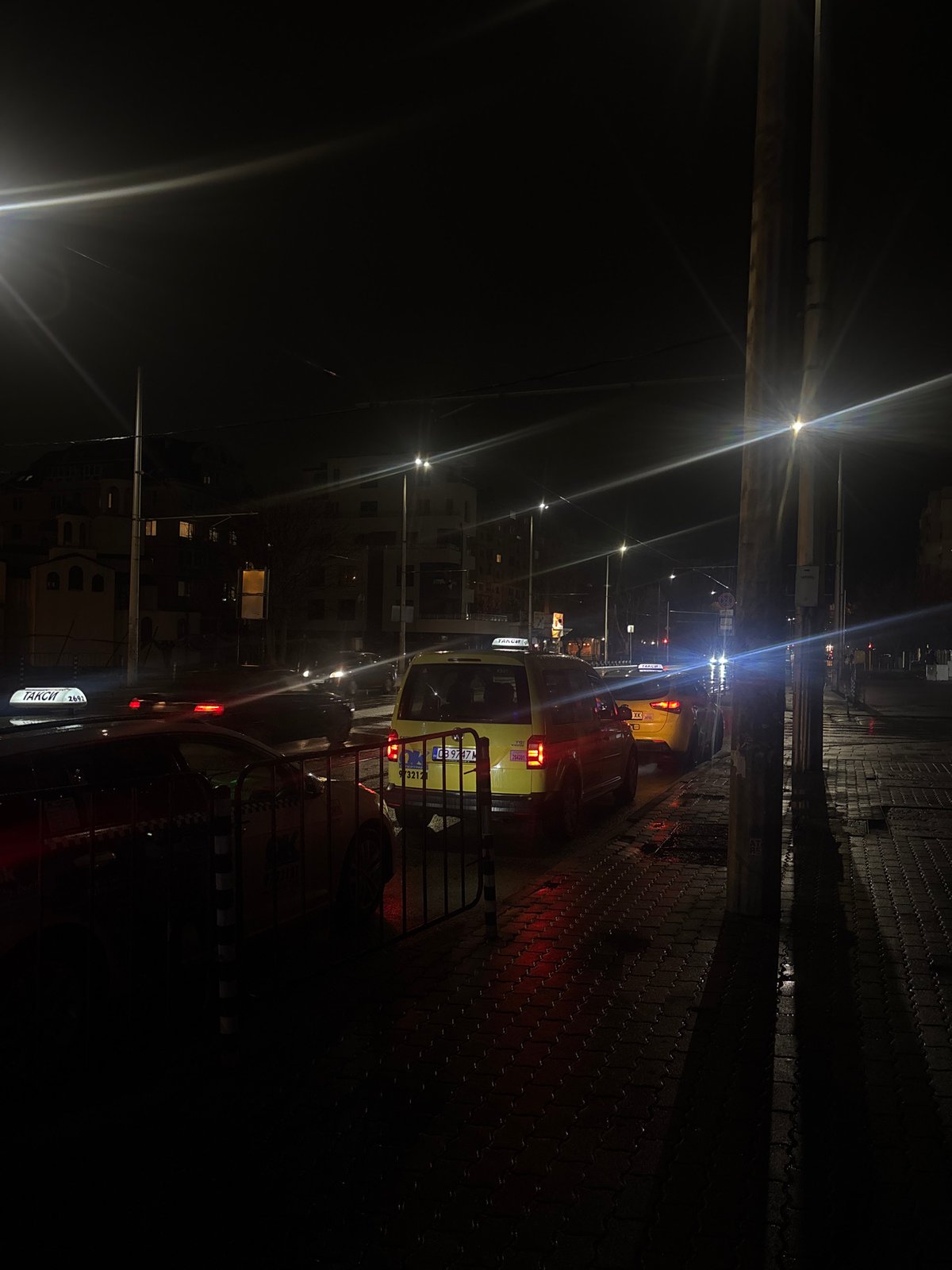 Evening scenes of people and taxis in Sofia