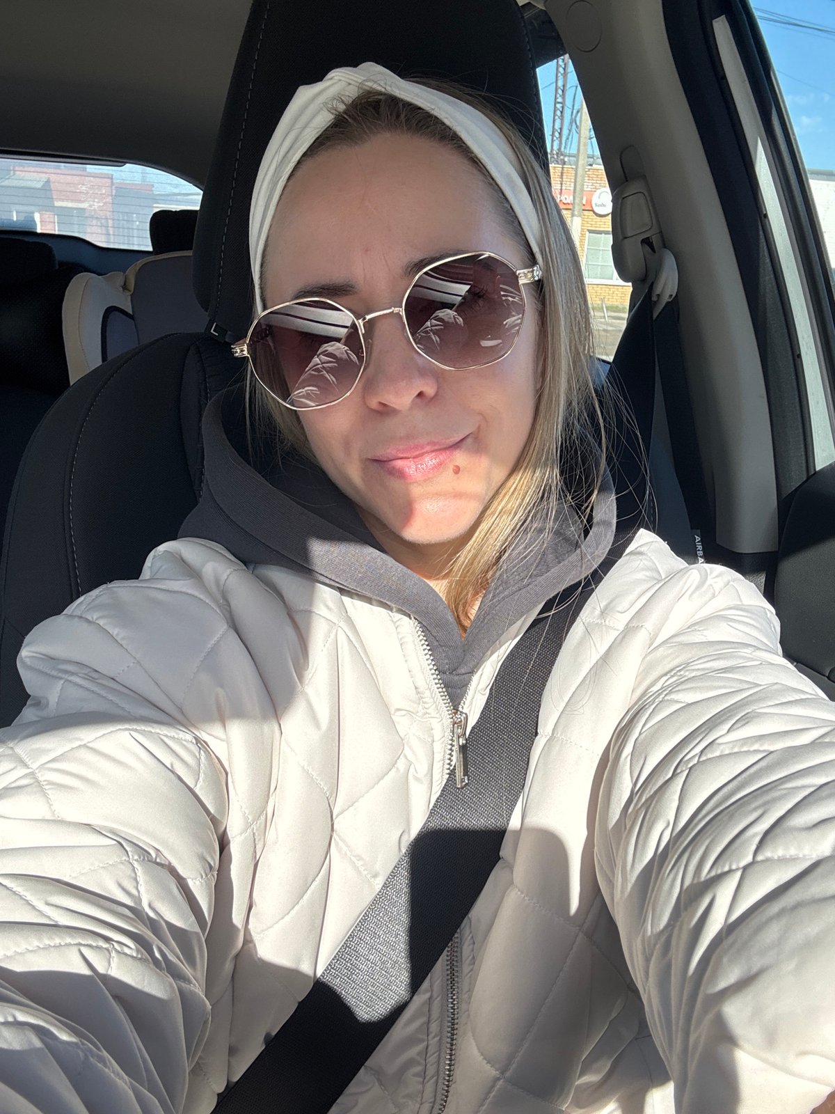 Woman in white jacket observed in vehicle, Chaikovsky