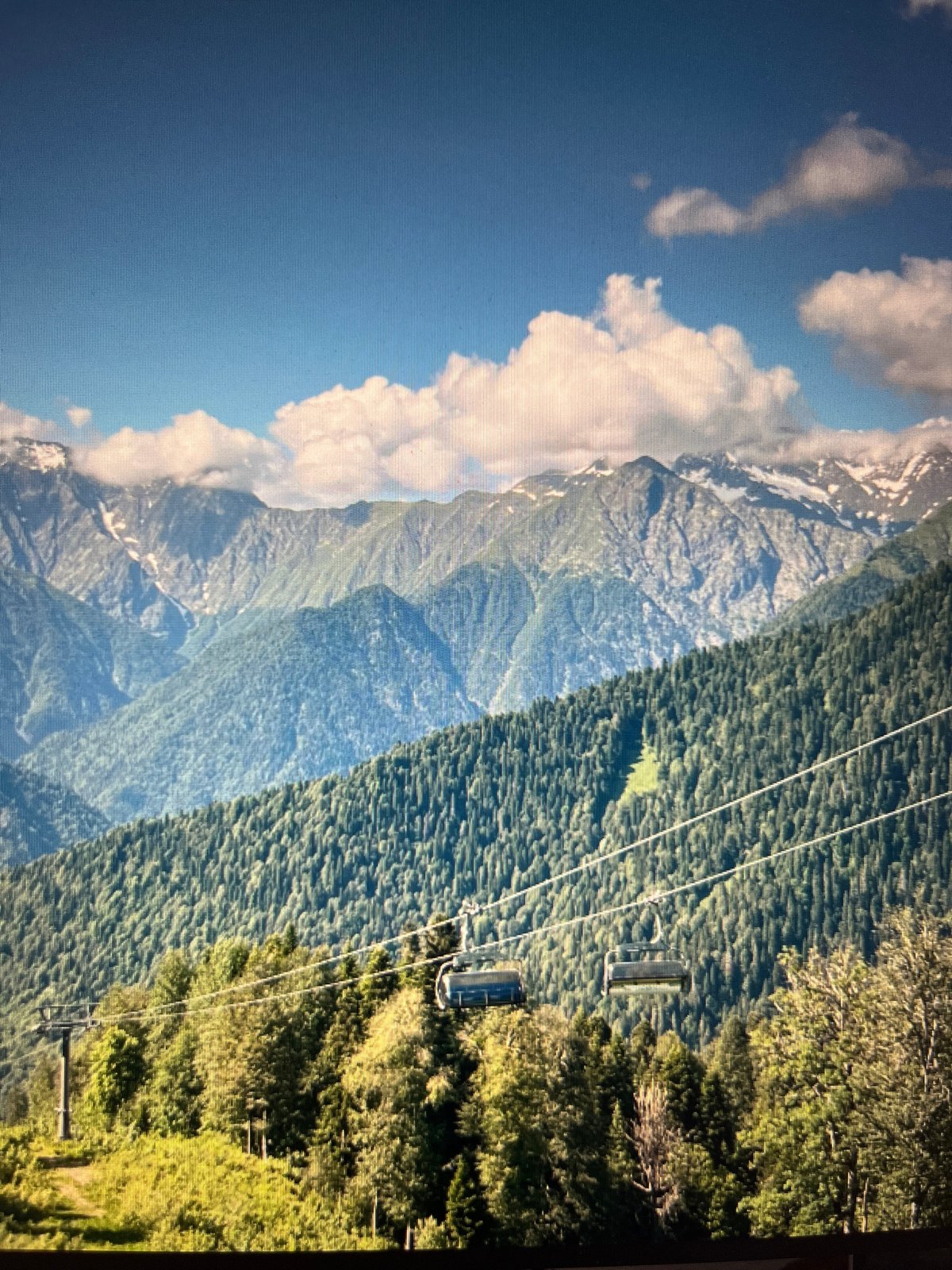 Mountain resort scenes and gorge views, likely Caucasus region