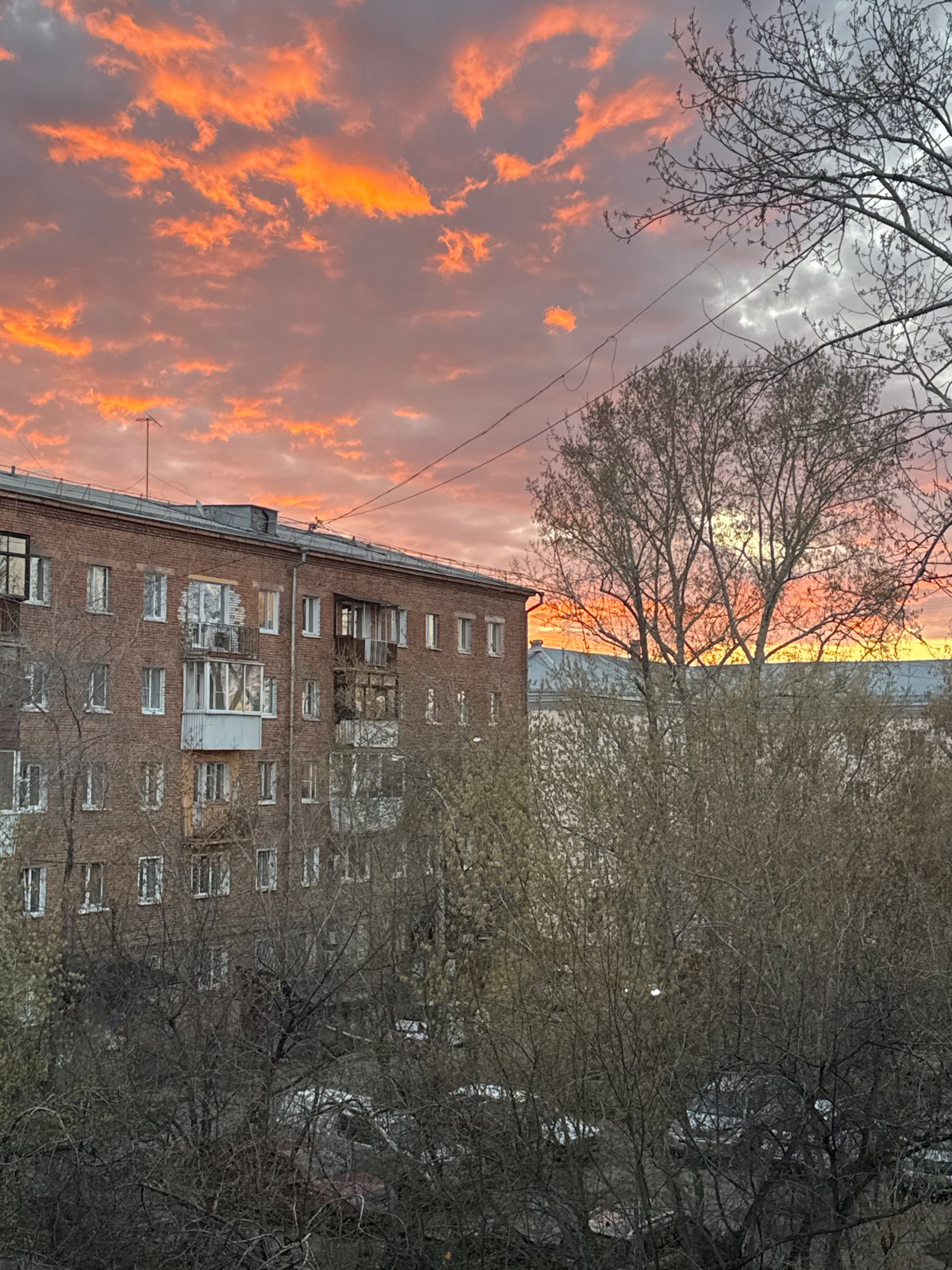 Sunset photographed over brick building in Irkutsk, Russia