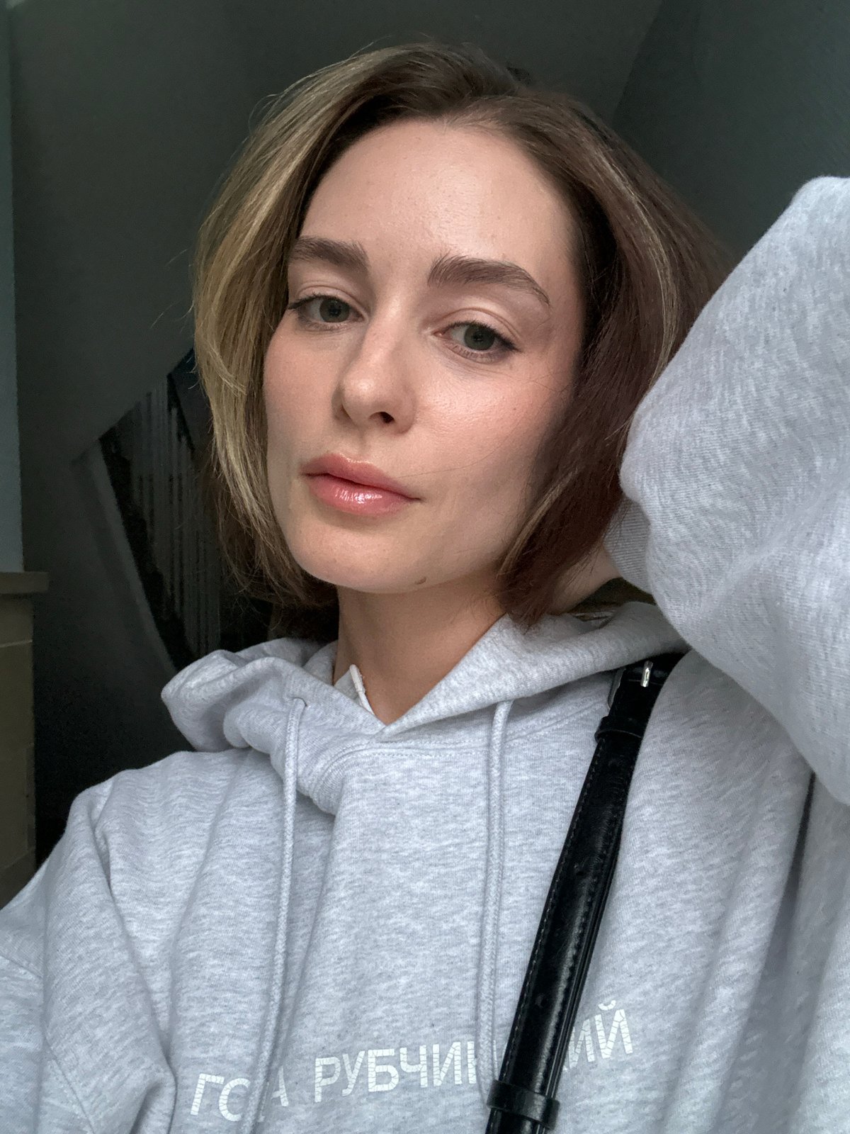 Woman photographed multiple times indoors in Kiel, Germany