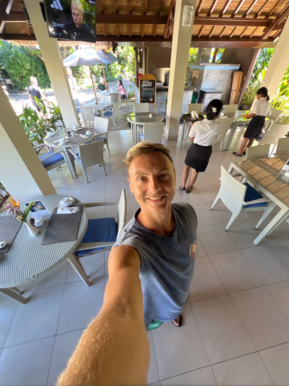 Tourist documents dining experience at Lovina resort in Buleleng