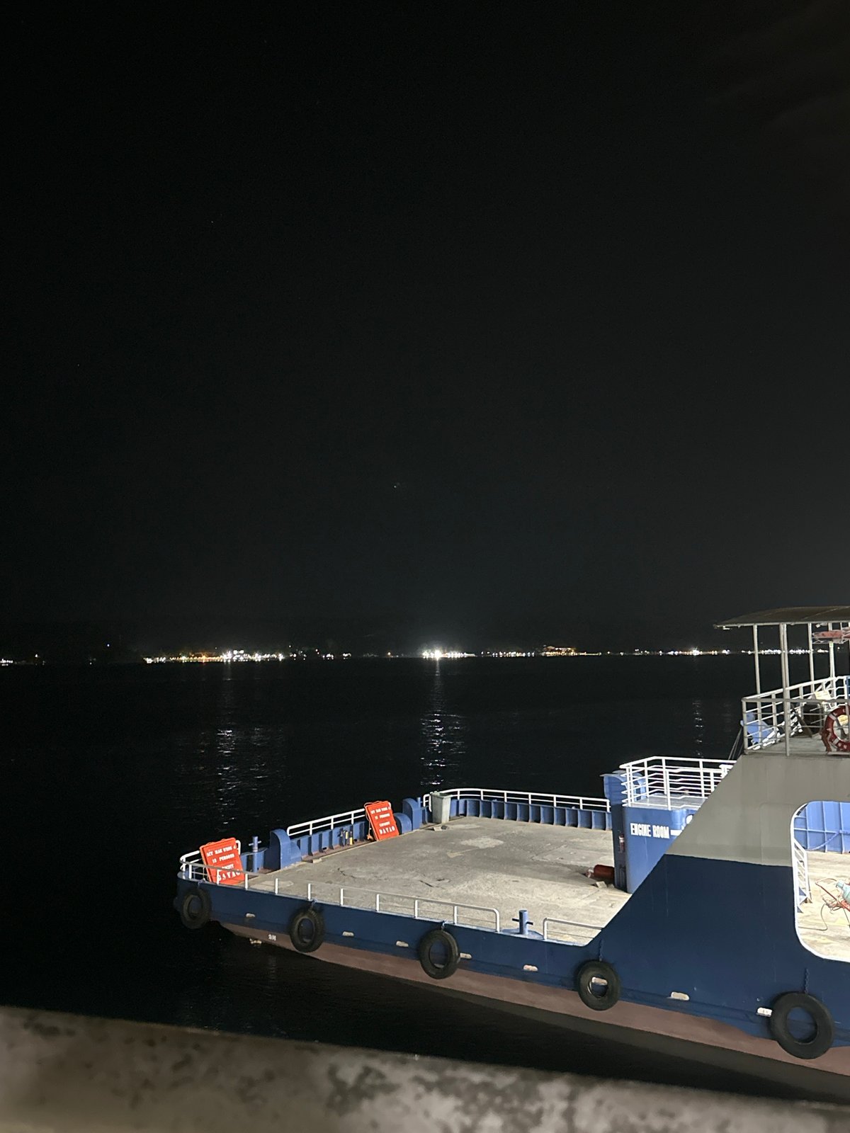 Nighttime ferry terminal activity documented in Davao City