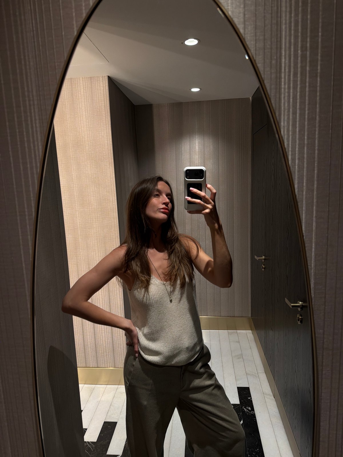 Woman takes bathroom selfies in Budva mirror