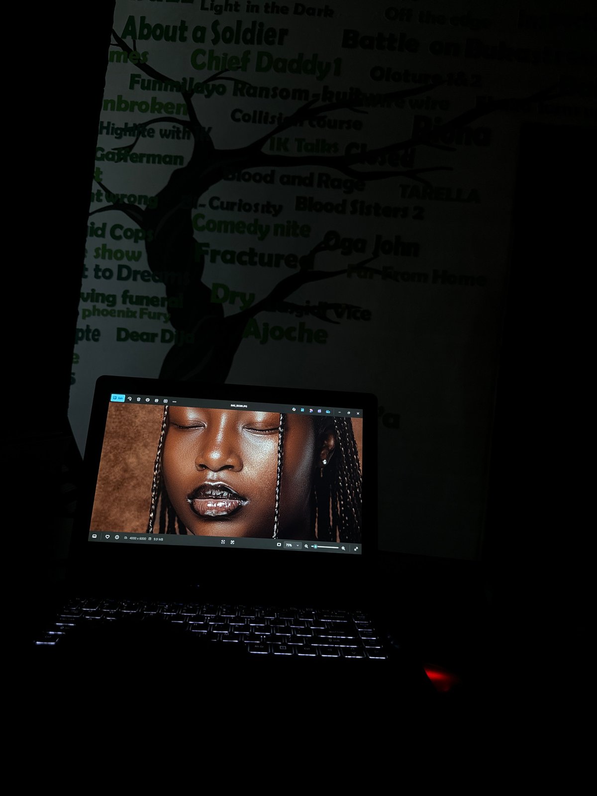 Nighttime laptop presentation session documented in Ikeja, Nigeria