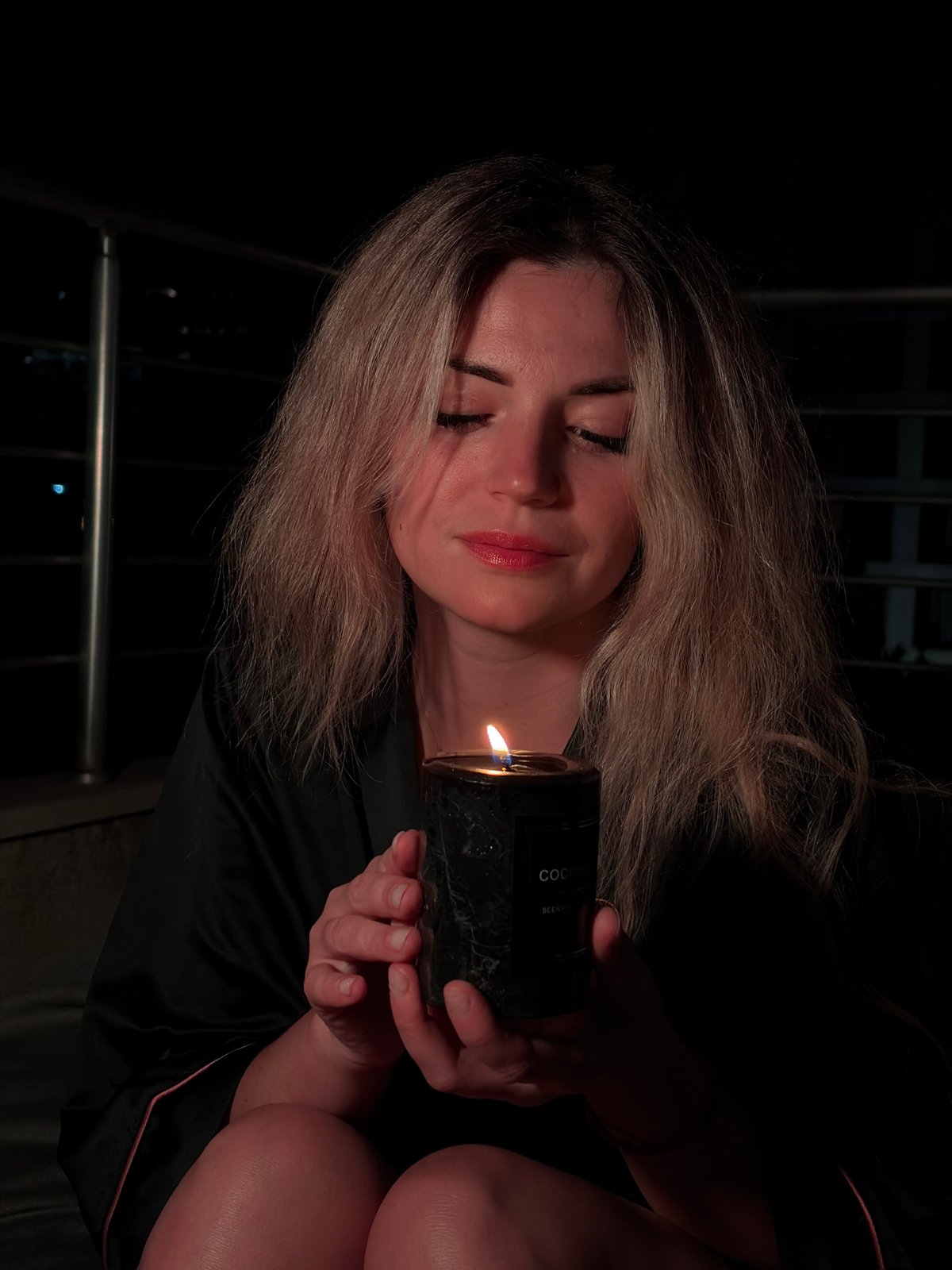 Candlelit balcony night and Budva's waterfront after dark