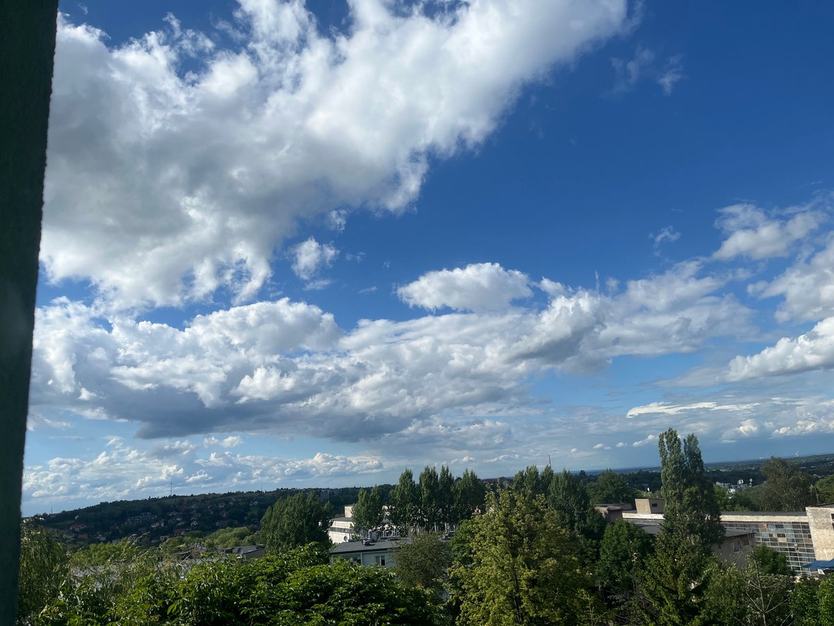 Afternoon sky-watching session with dramatic clouds over cityscape
