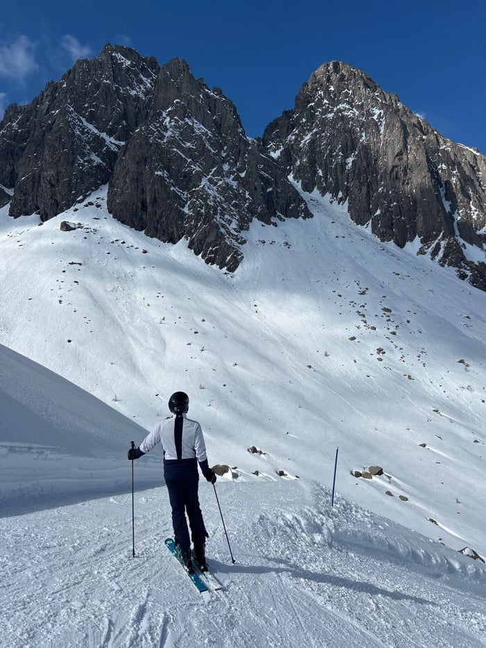 Lone skier documented on alpine slopes during spring afternoon