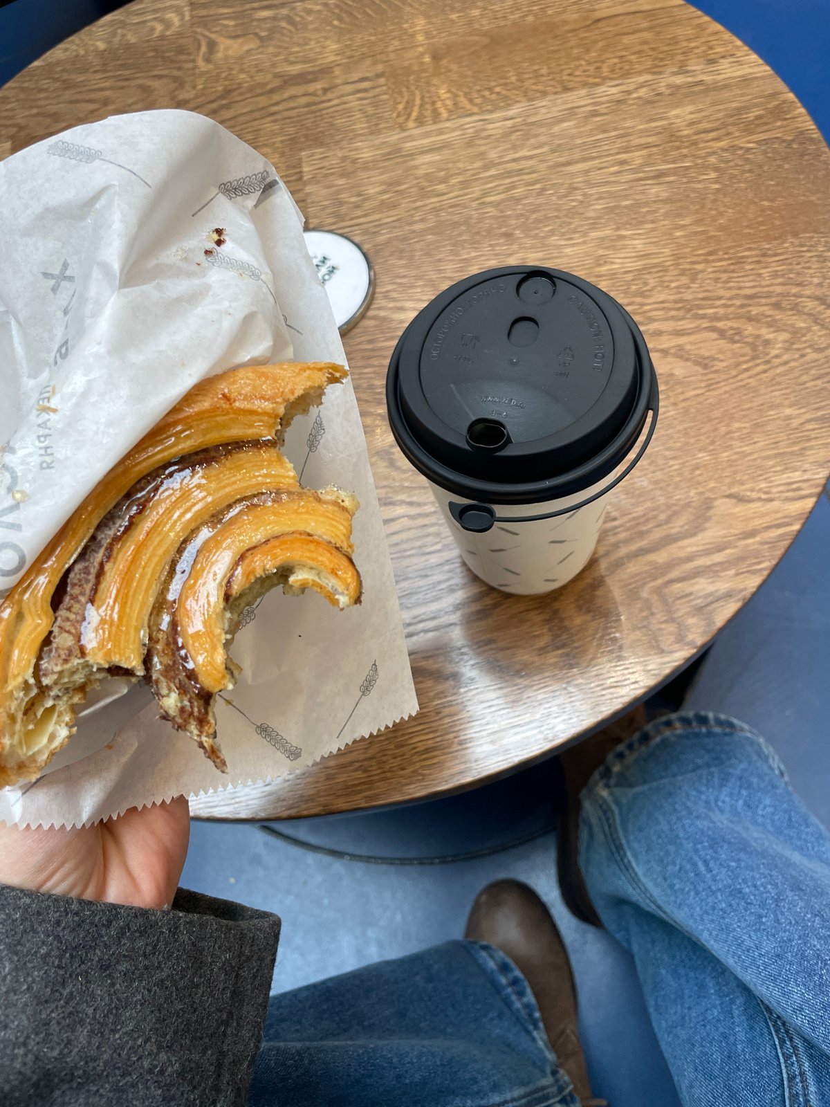 Person enjoys pastry indoors in Moscow