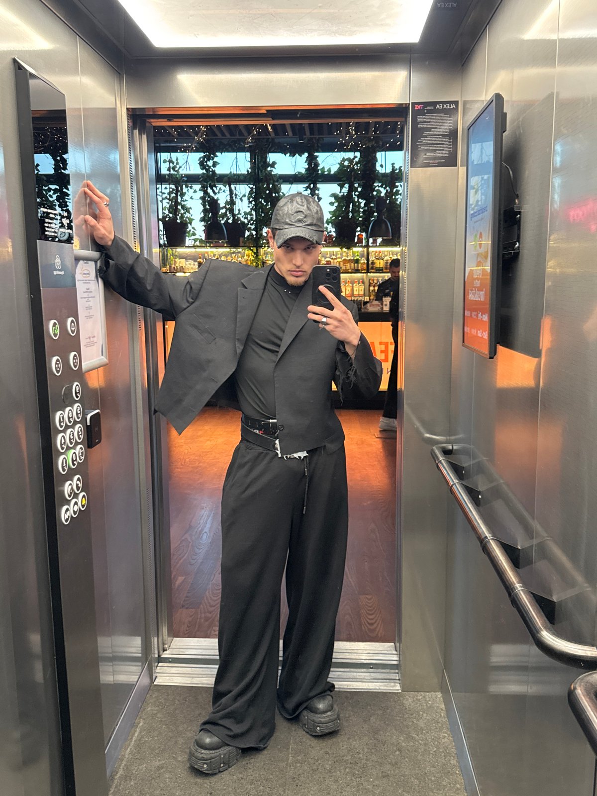 Person takes elevator selfie, stands on doormat in Sofia