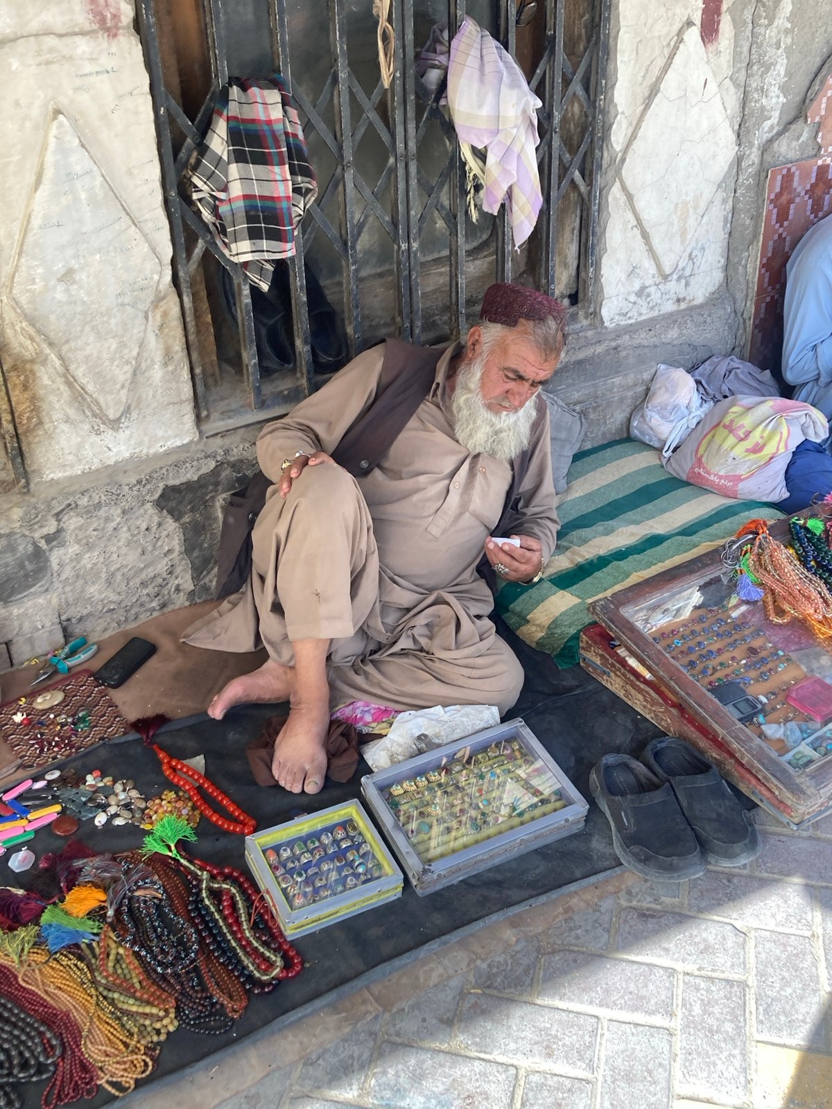 Street vendors sell jewelry and trinkets in Quetta