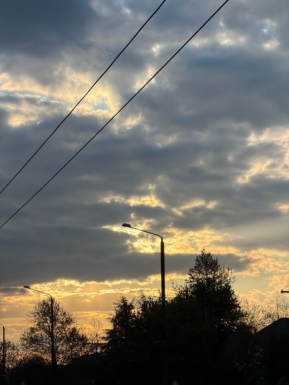 Dramatic sunset illuminates cloudy sky over Varna, Bulgaria