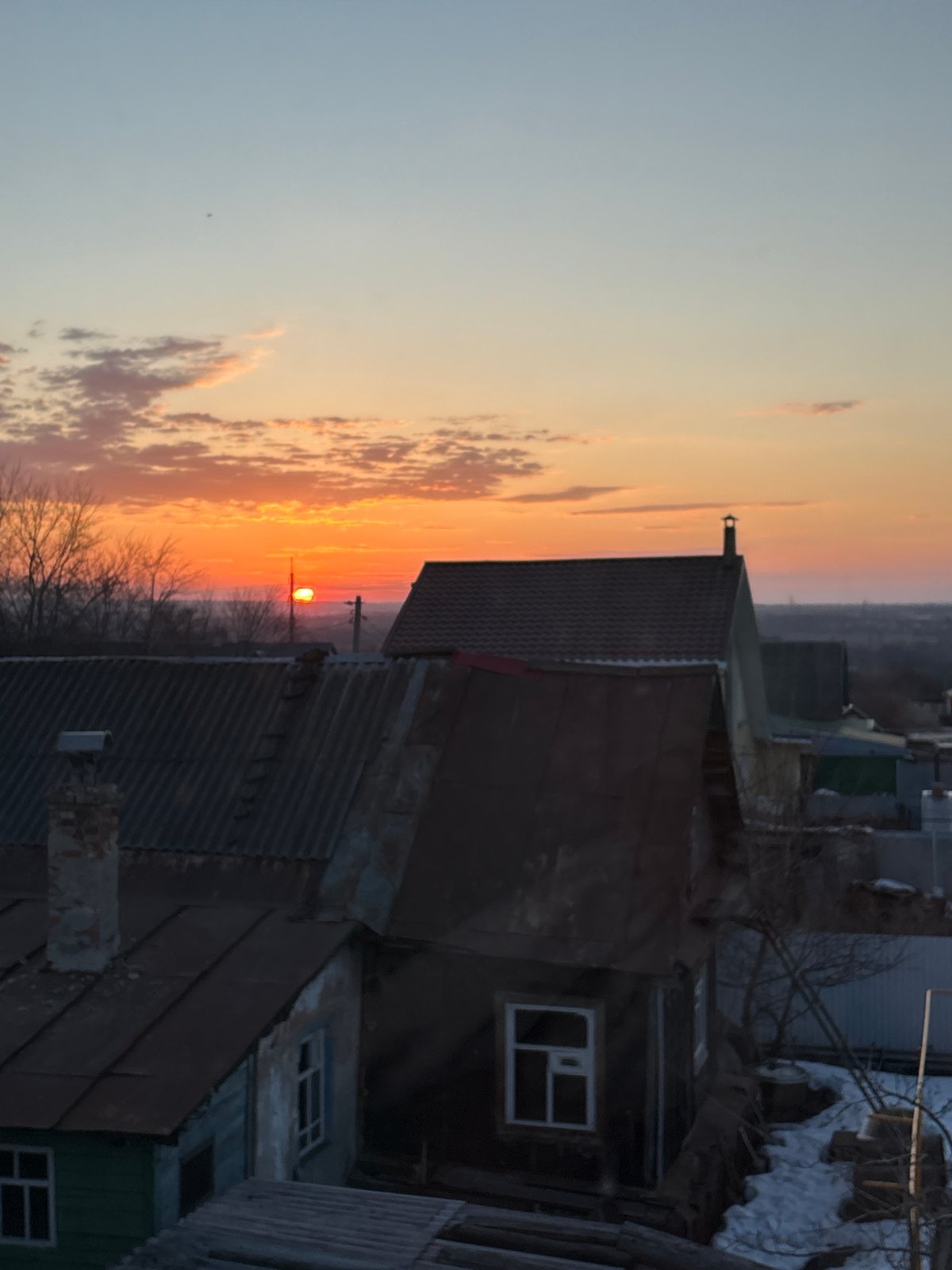 Sunset captured over Ulyanovsk cityscape from multiple viewpoints