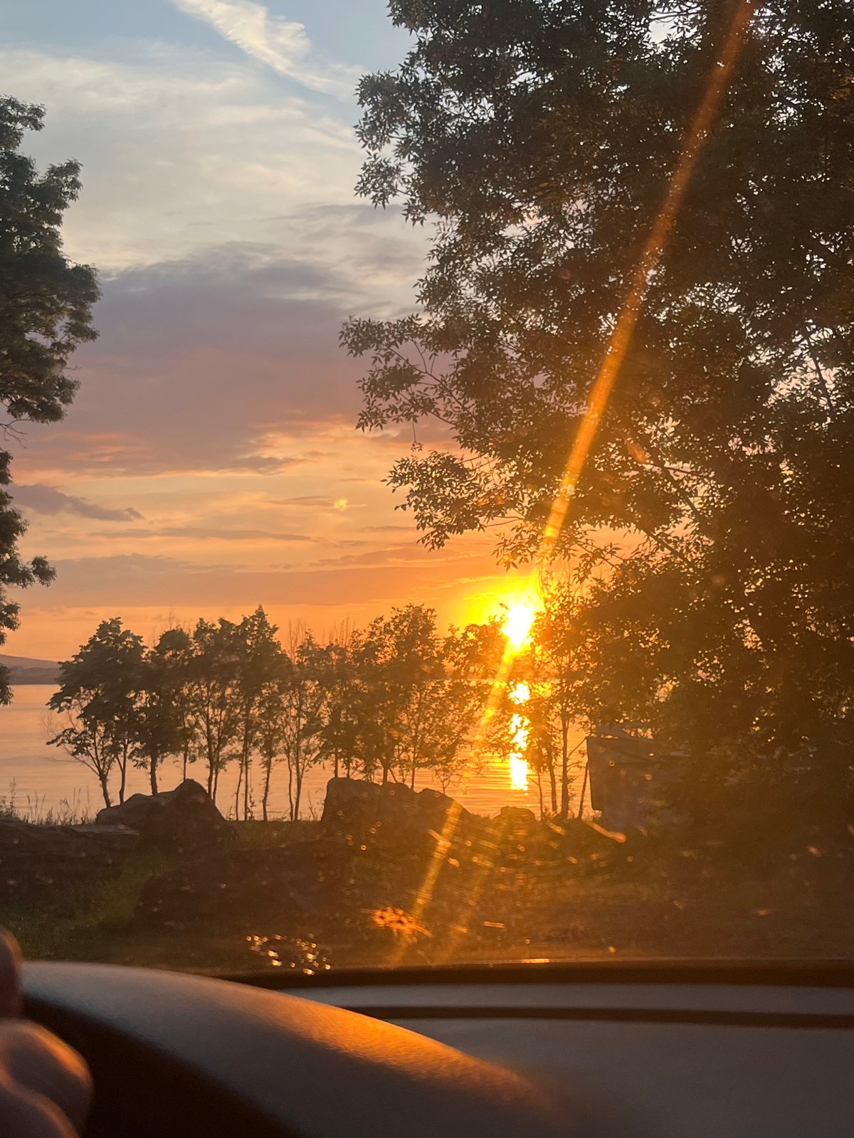 Sunset over water witnessed from multiple locations in Burgas