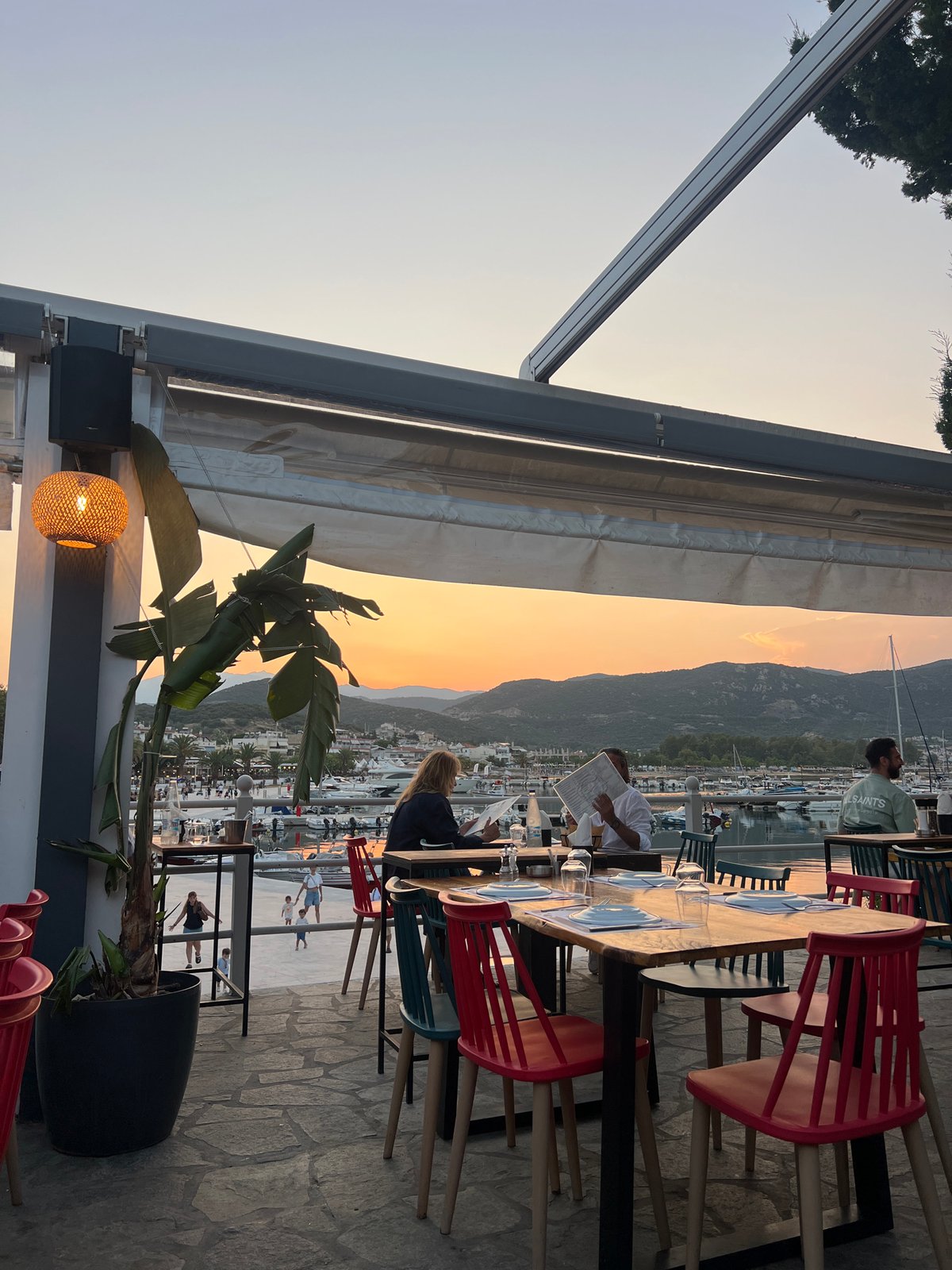 Sunset dinner at a marina, then arcade games after dark