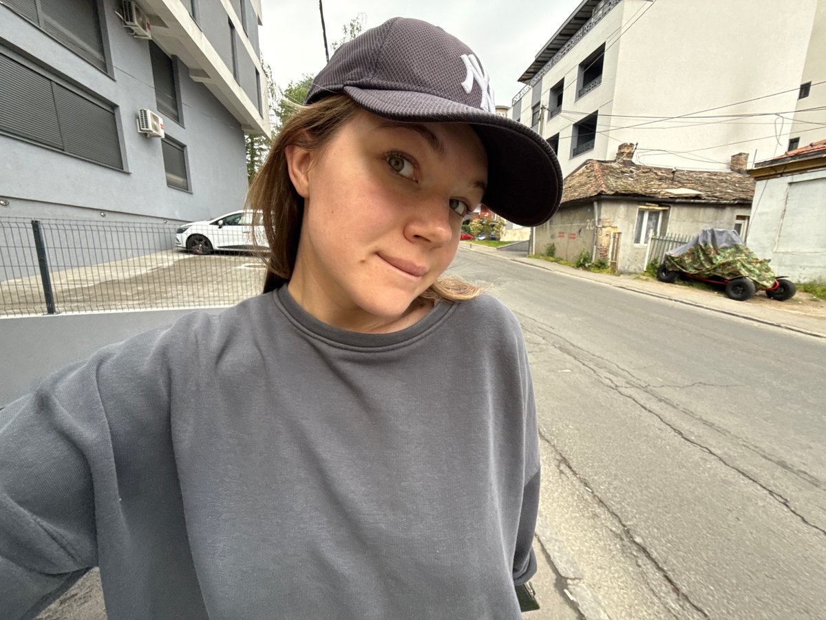 Young person takes morning selfies around Belgrade neighborhood
