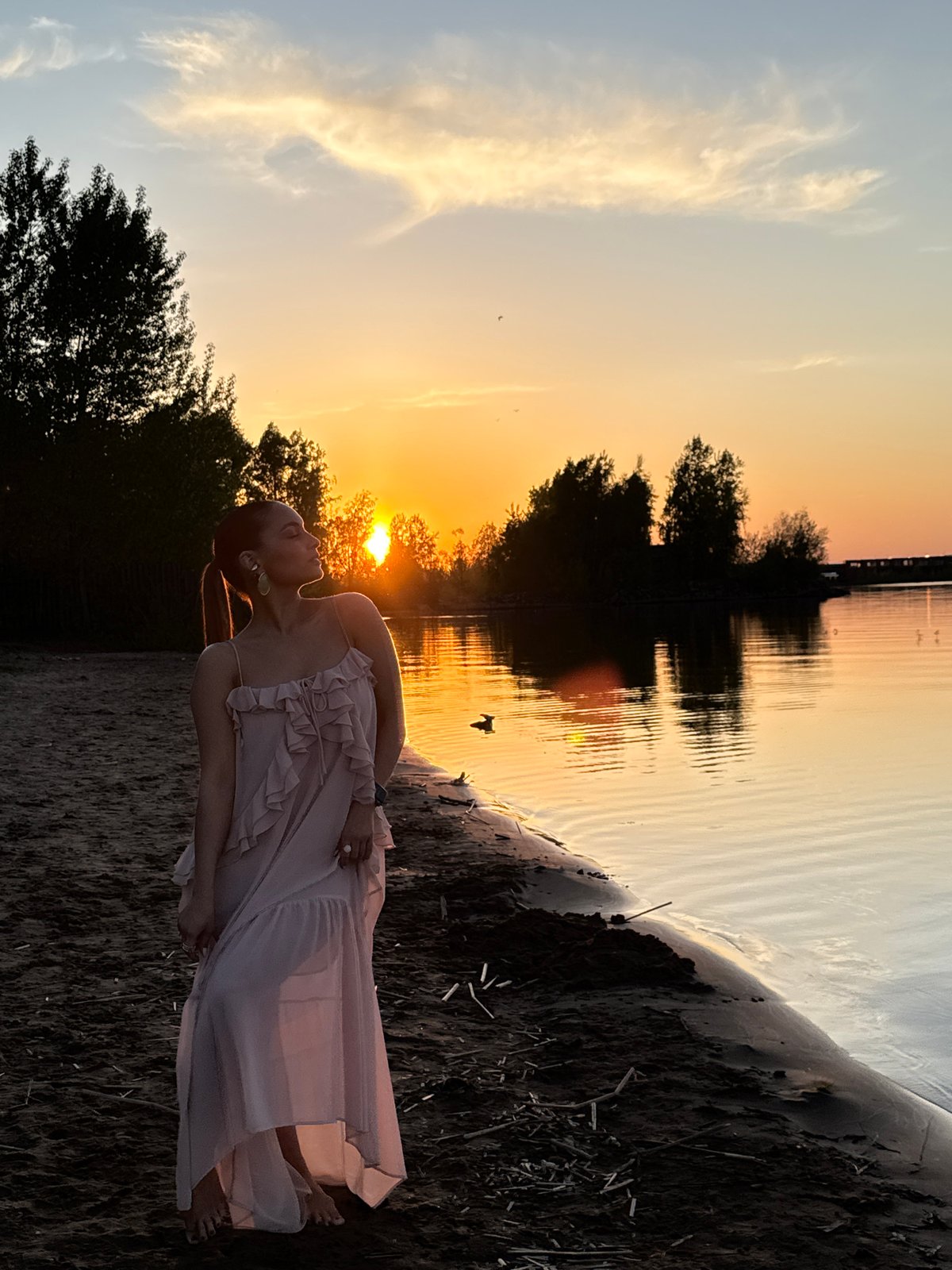 Mother and child enjoy sunset beach moment in Chaikovsky