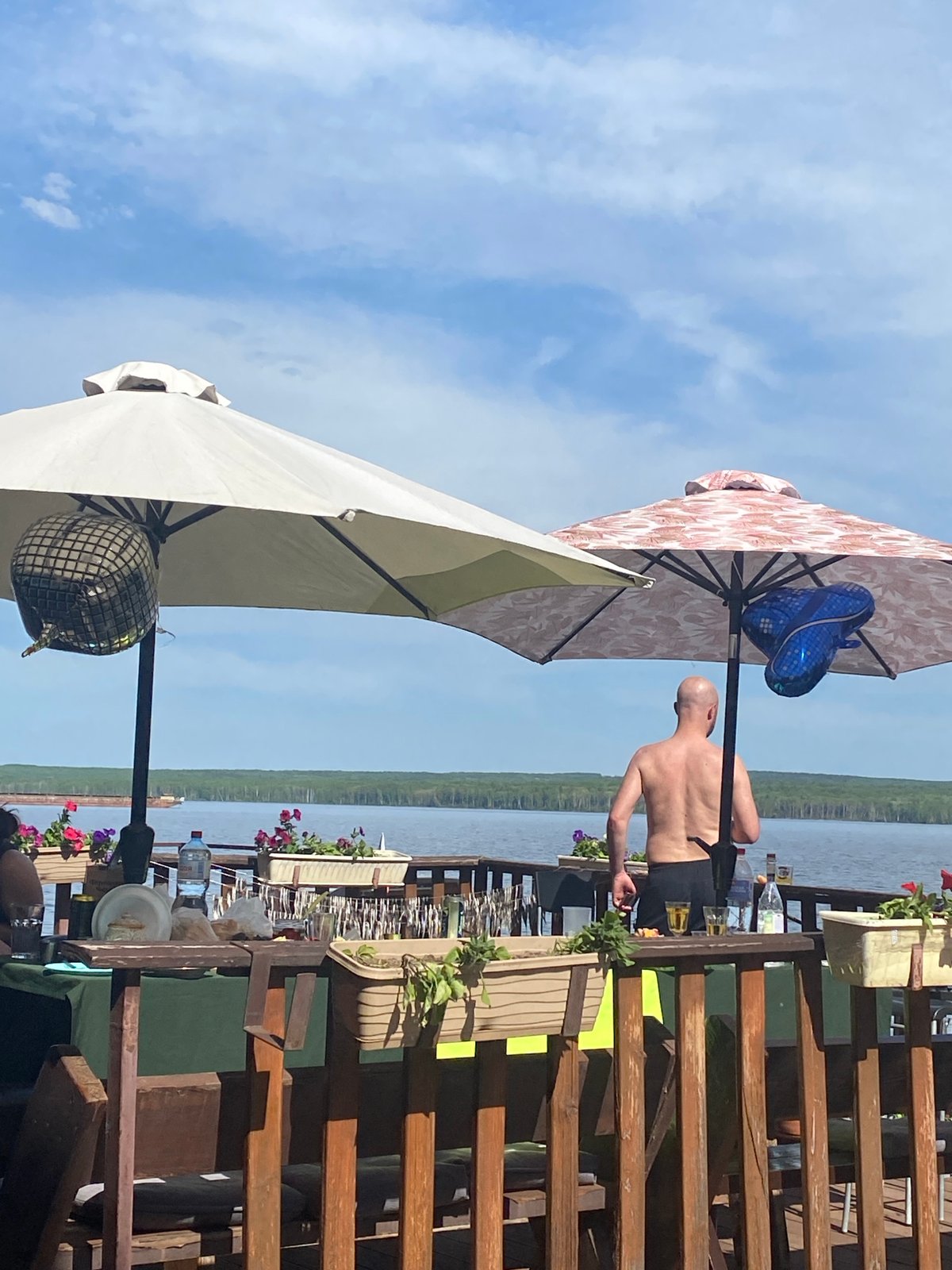 Riverside gathering with balloons, motorcycles documented in Chaikovsky, Russia