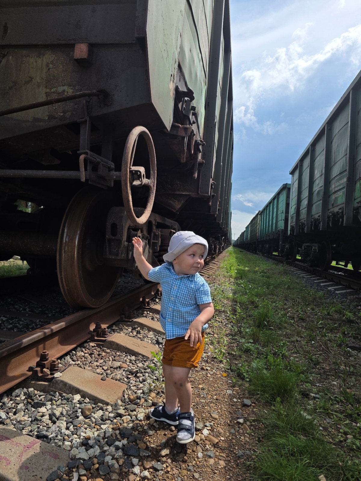 Toddler explores a freight rail yard in Chaikovsky, Russia