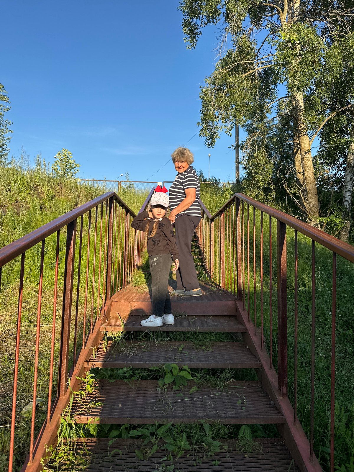 Summer afternoon at a Chaikovsky park — people, pets, and sunshine