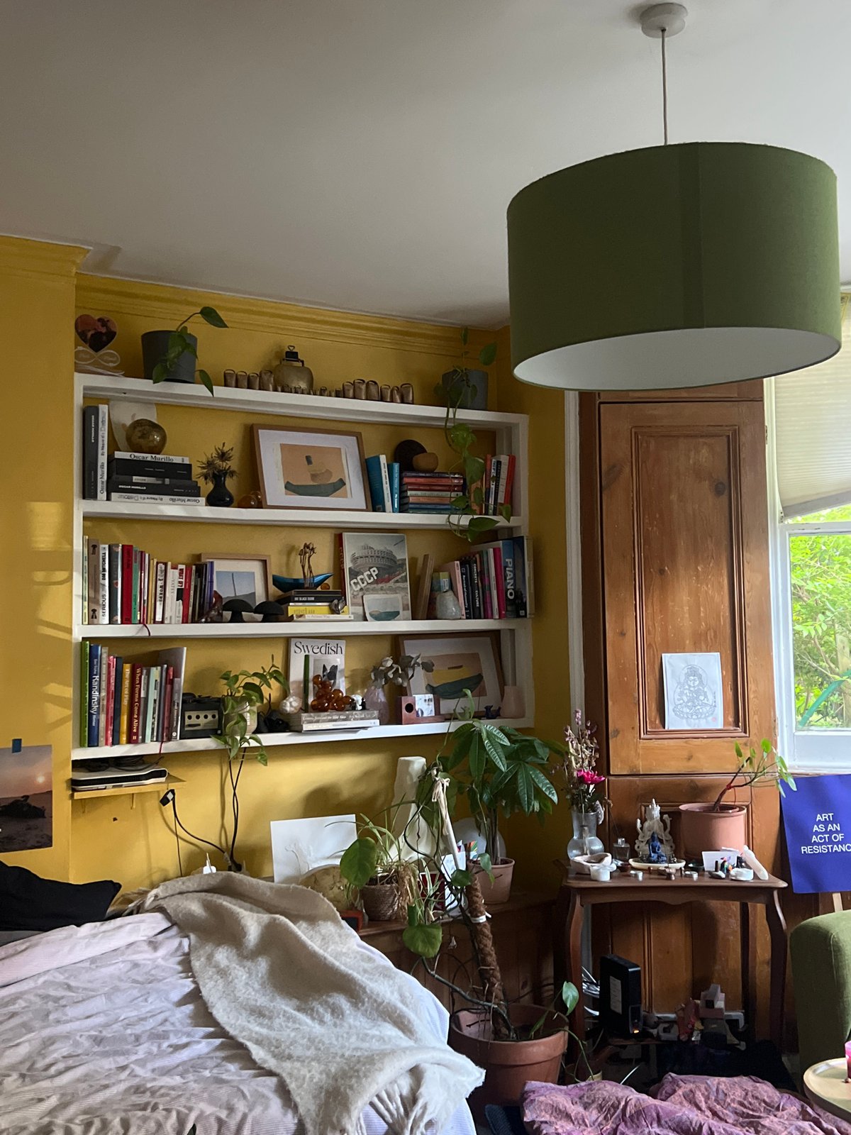 Inside a characterful London home, yellow walls and quirky art